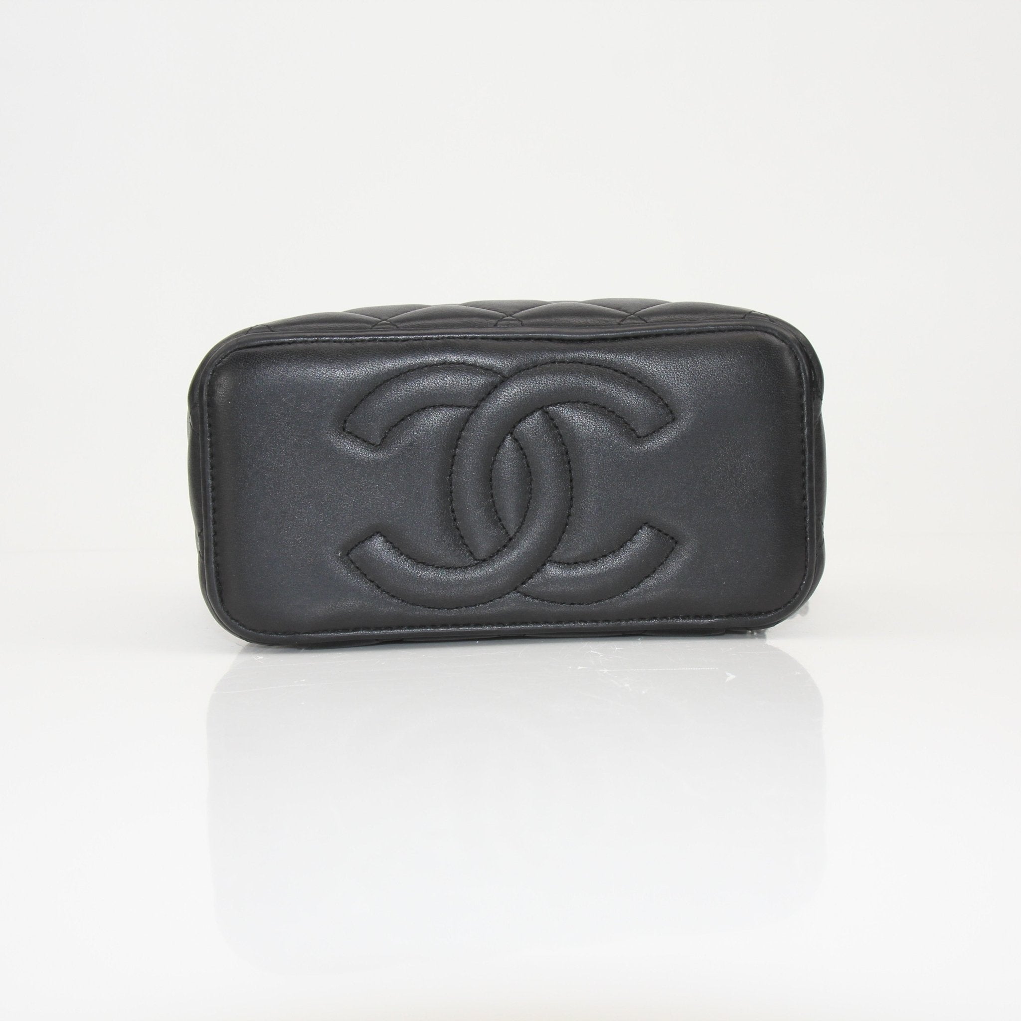 Gold & Beyond Chanel Vanity Bag for travel, stylish black leather with gold-tone hardware and spacious interior.
