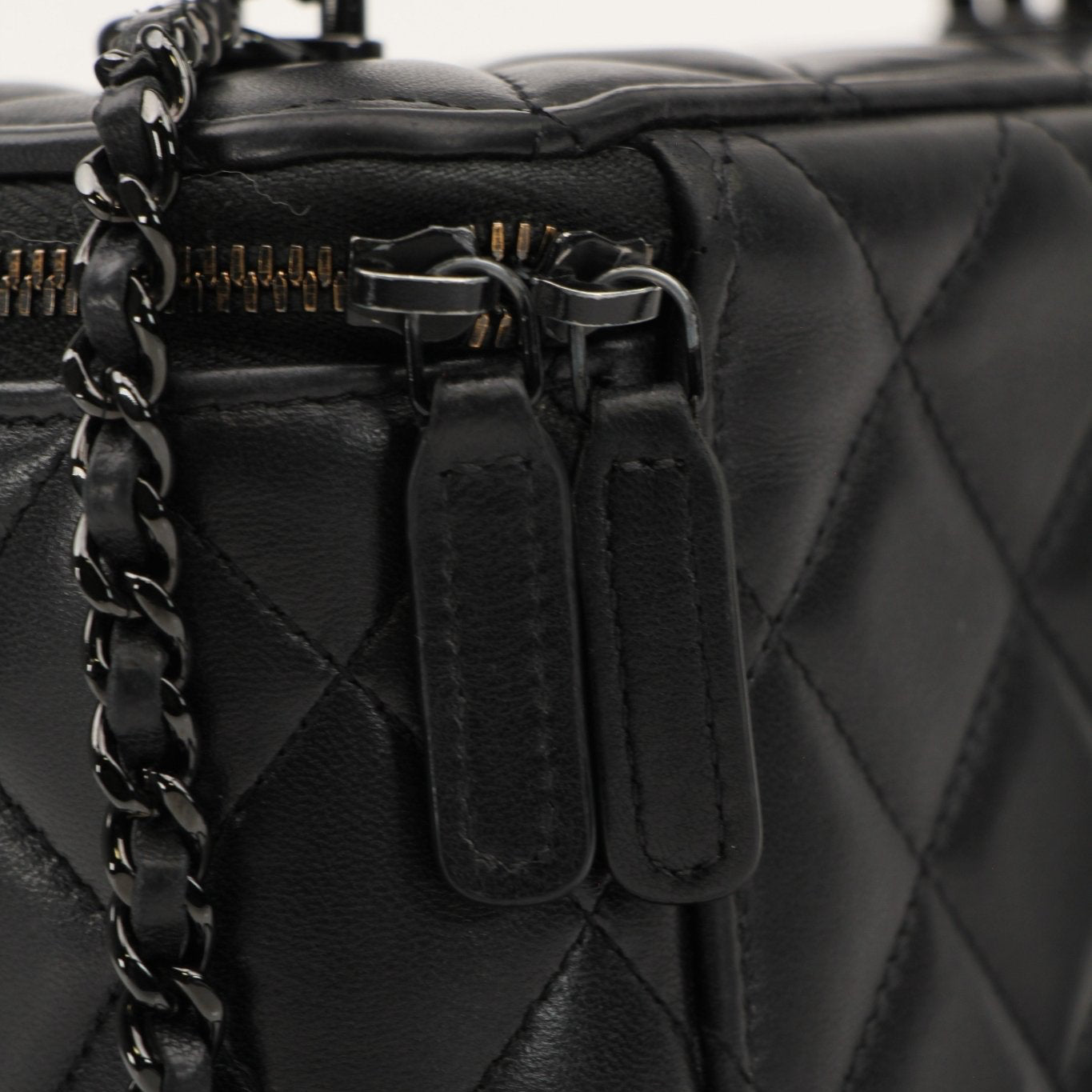 Gold & Beyond Chanel Vanity Bag for travel, featuring a sleek design with multiple compartments and elegant gold accents.