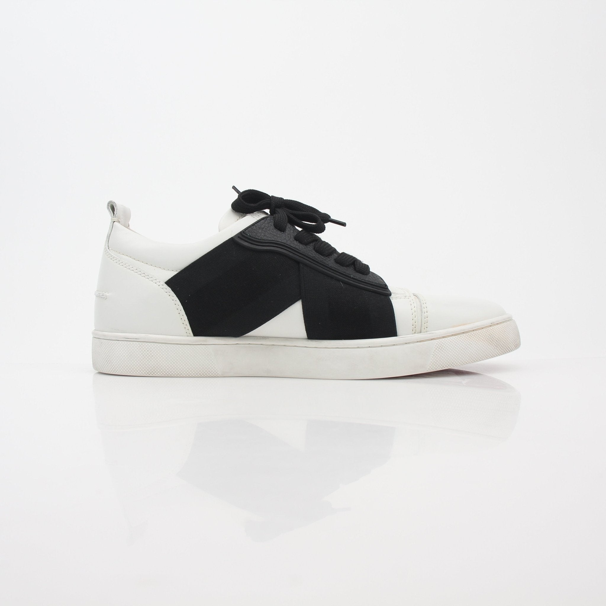 Christian Louboutin White and Black Elastikid sneakers, stylish shoes with sleek design, featuring white and black color blocks.