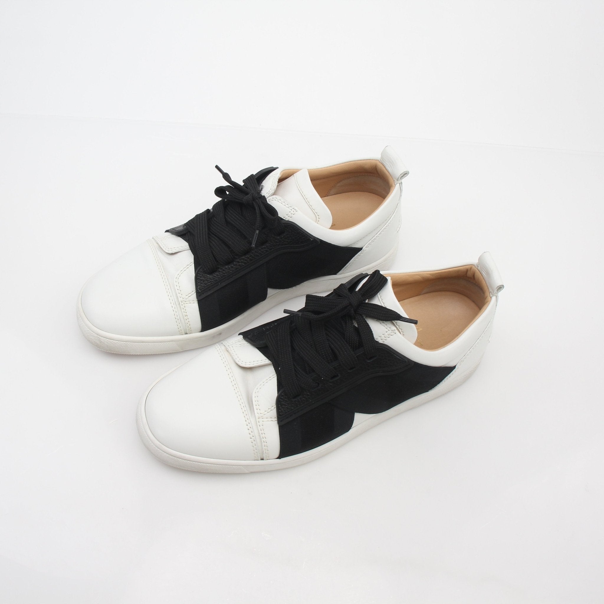 Christian Louboutin Elastikid sneakers in black and white with red soles, casual shoes for stylish comfort.