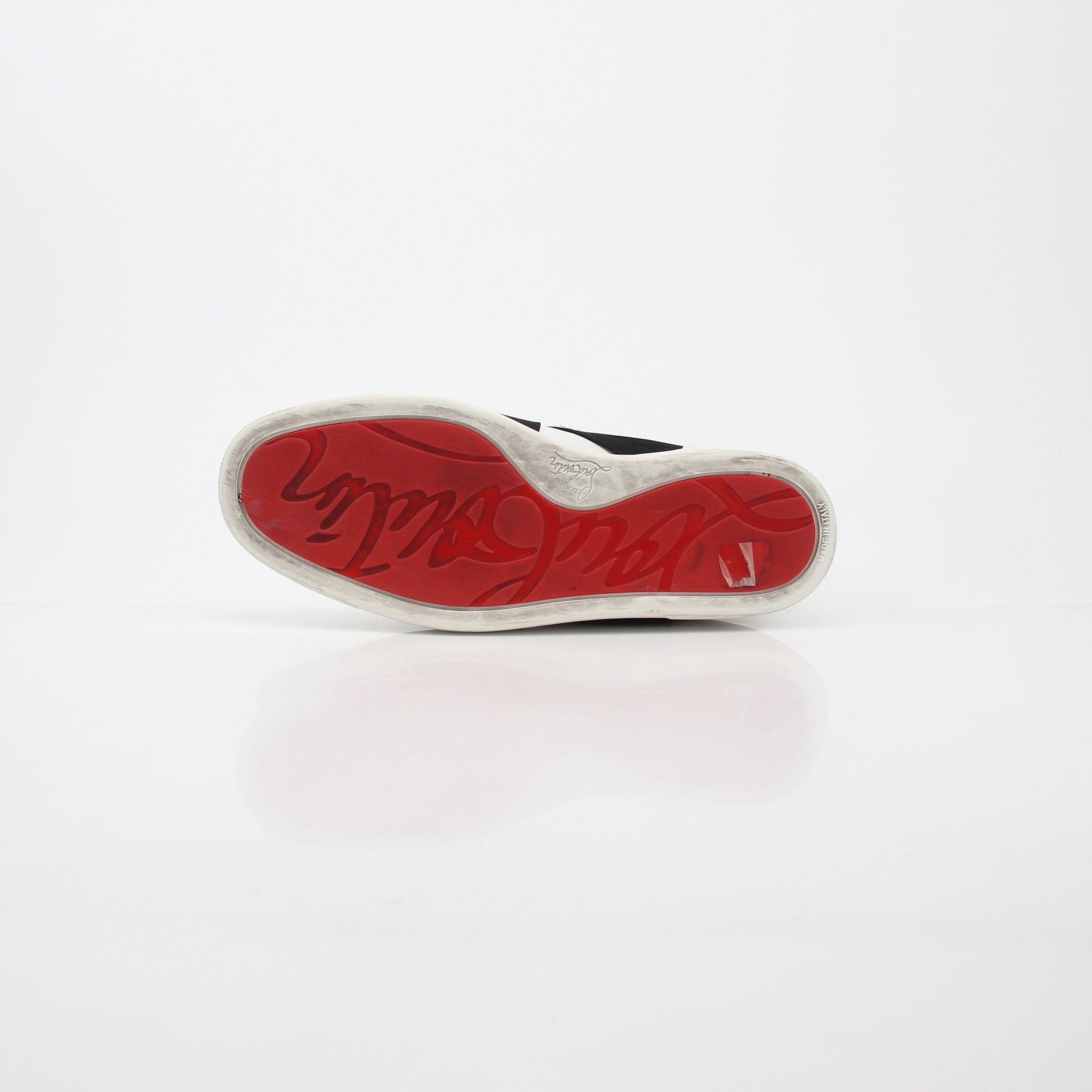 Christian Louboutin White and Black Elastikid sneakers, stylish shoes with sleek design and brand logo visible in the image.