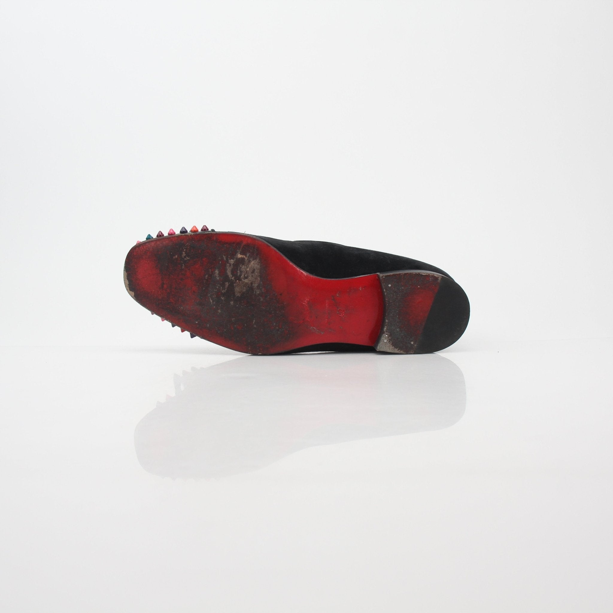 Christian Louboutin black spooky multicolor spike loafers with pointed toes and decorative spikes, stylish shoes by Gold & Beyond.