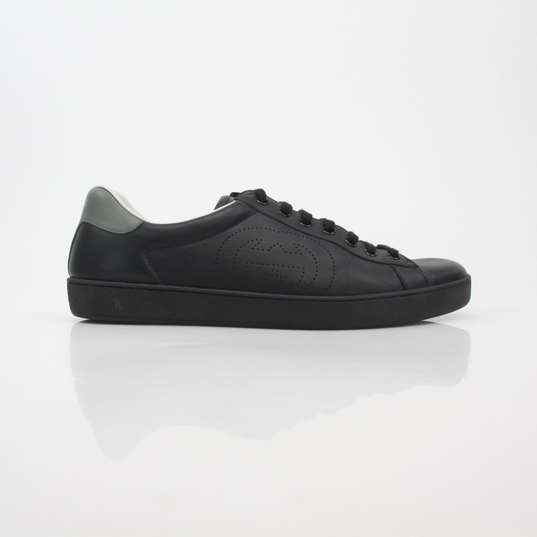 Gucci Black Ace perforated leather sneakers with interlocking G logo, stylish casual shoes from Gold & Beyond.