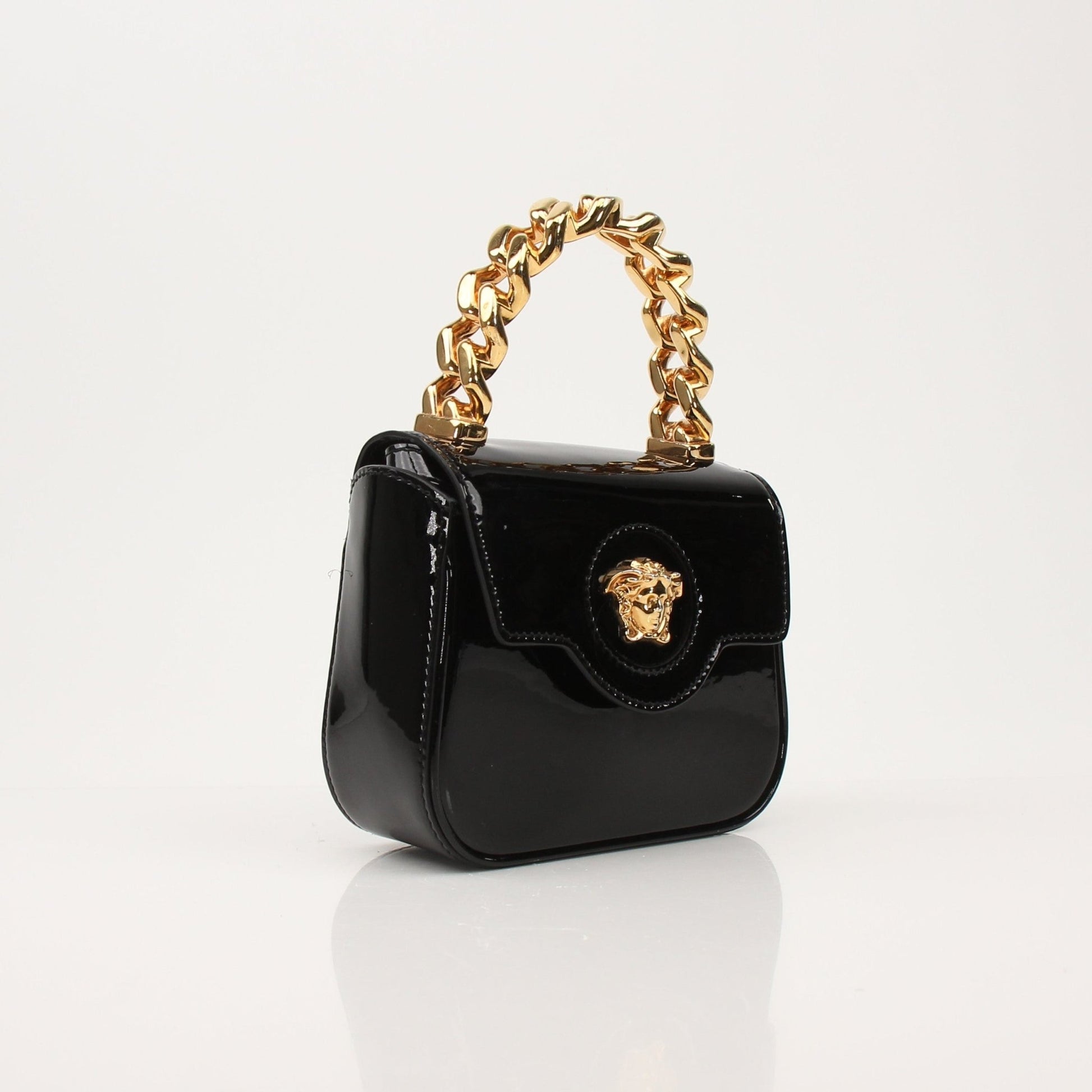 Gold & Beyond Versace La Medusa Mini Bag handbag with gold hardware and Medusa logo, featuring a sleek design and compact size.