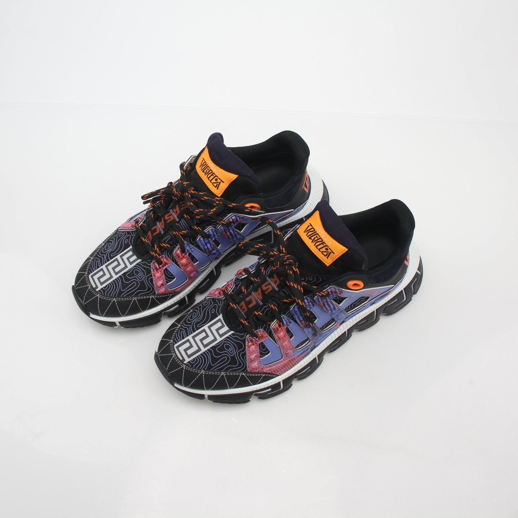 Versace Trigreca multicolor sneakers showing a stylish design with vibrant patterns and brand logo on the shoes.
