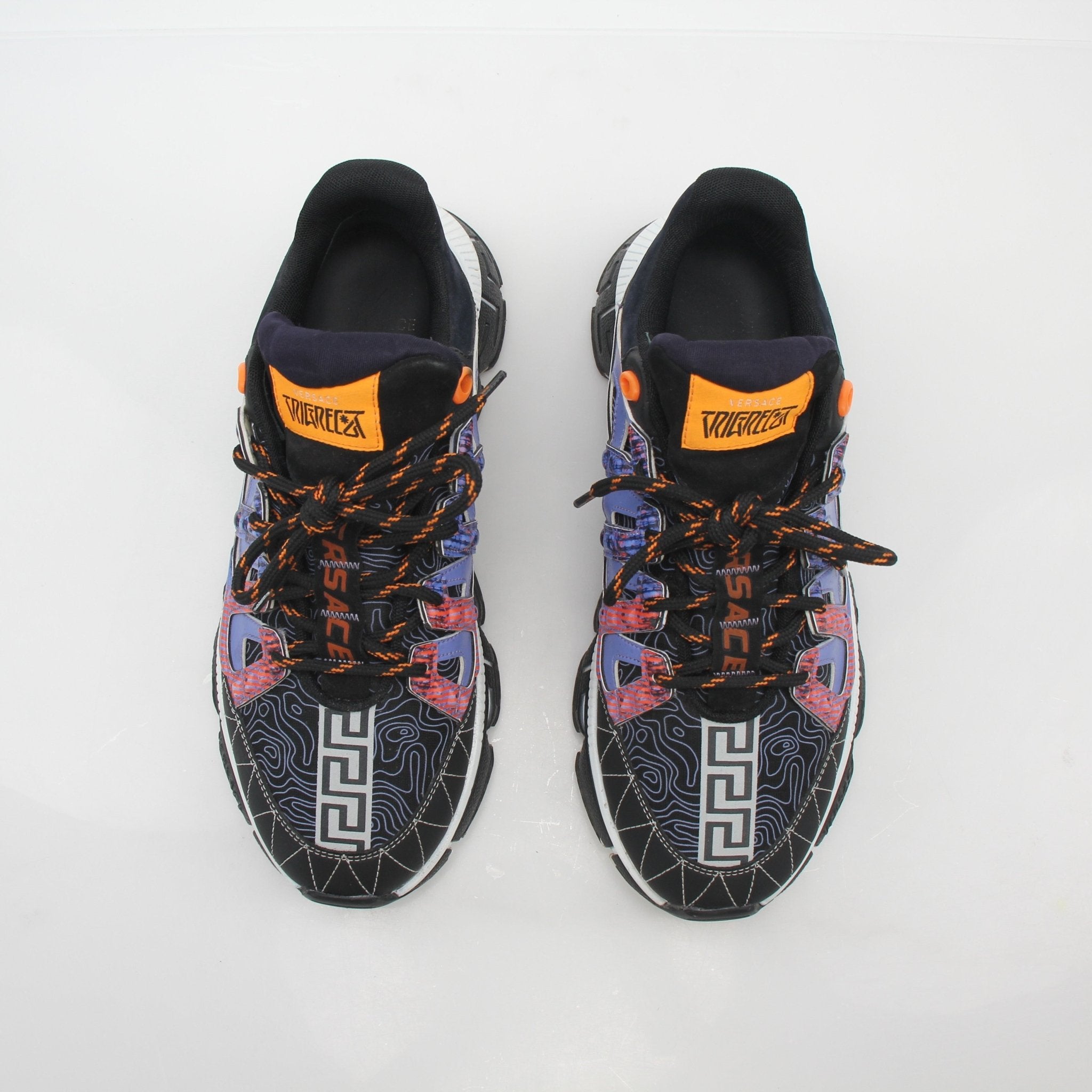 Gold & Beyond Versace Trigreca multicolor sneakers showcasing vibrant design, sporty shoes with stylish multicolor accents.