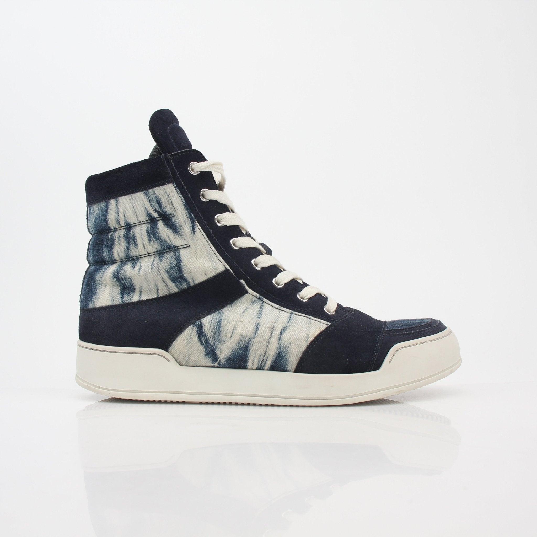 Gold & Beyond Balmain blue tie-dye denim high-top sneakers with white rubber soles and stylish laces, front view.