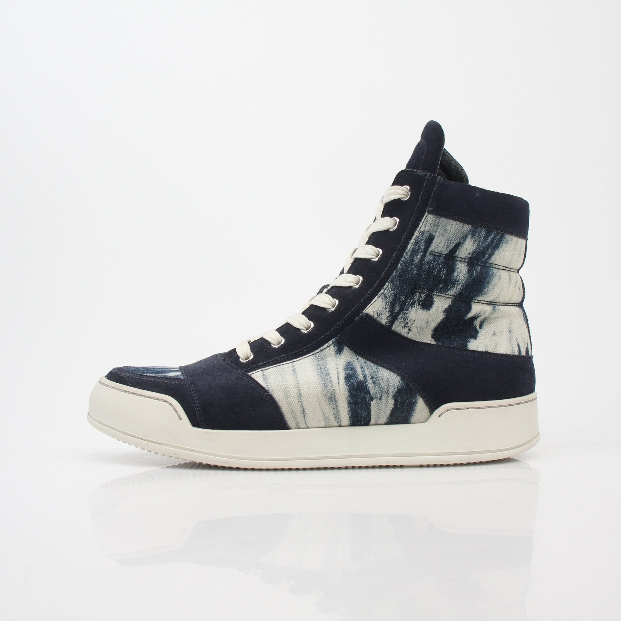 Gold & Beyond Balmain blue tie-dye denim high-top sneakers with white soles and laces, showcasing trendy casual shoes.