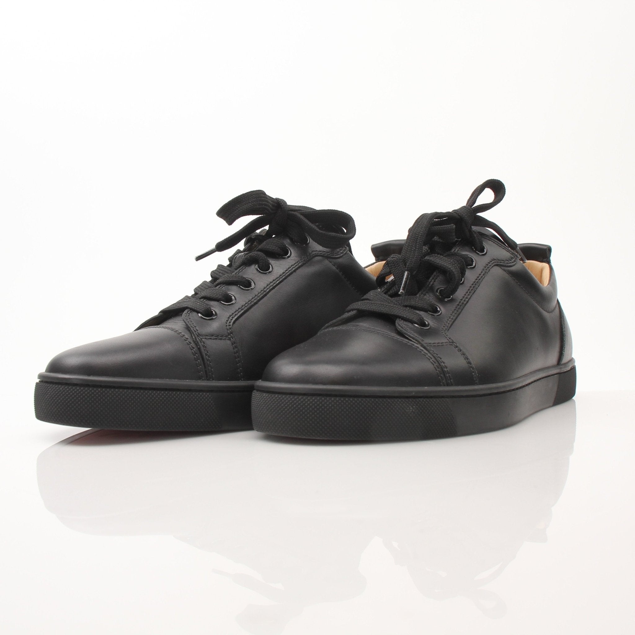 Christian Louboutin Louis Junior sneakers by Gold & Beyond, stylish shoes with signature red soles and sleek design.