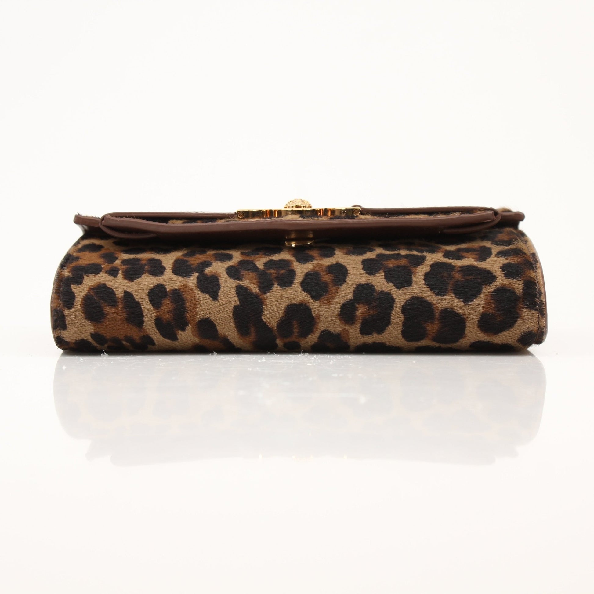 Gold & Beyond Versace Leopard Pony Hair Clutch handbag with animal print and sleek design.