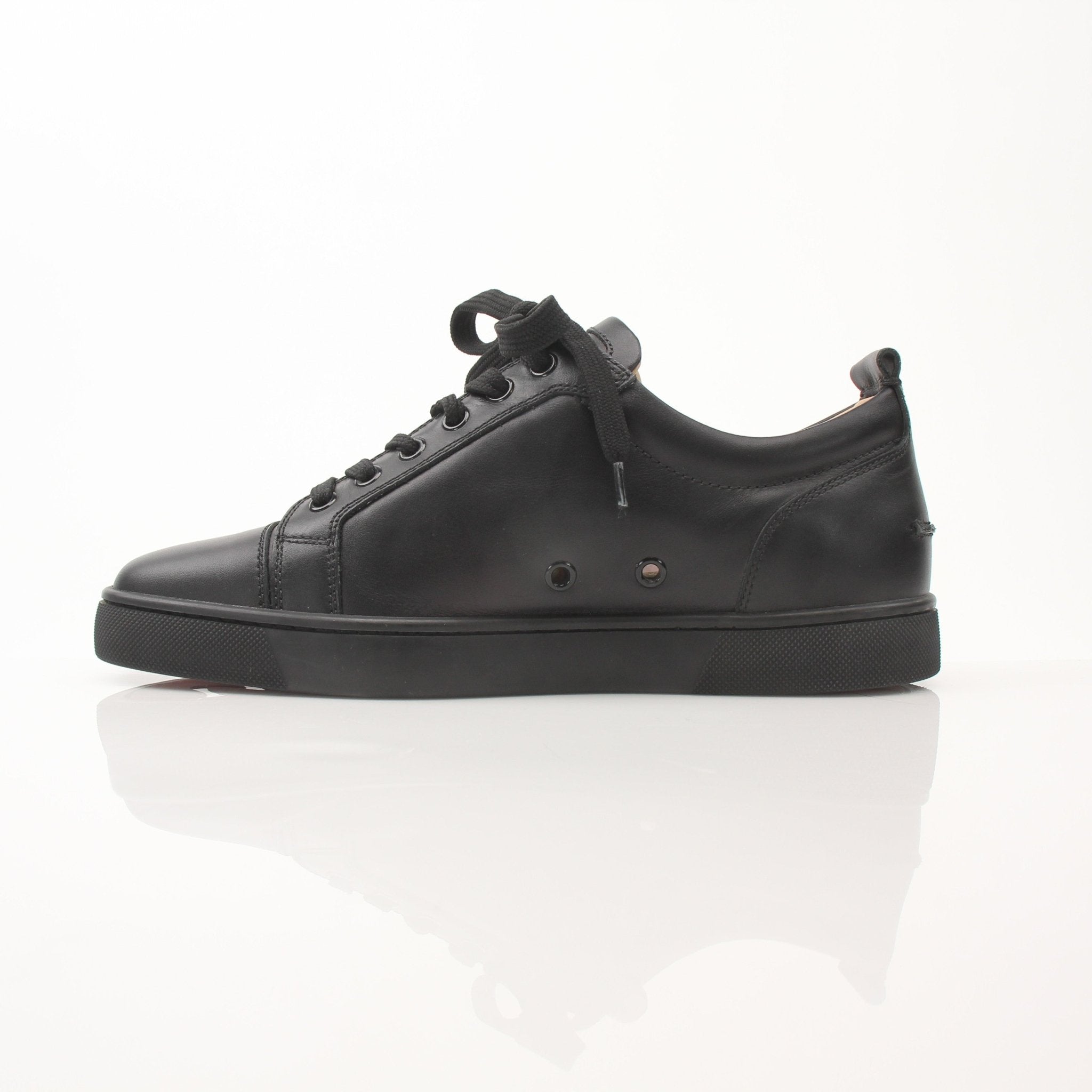 Christian Louboutin Louis Junior sneakers in black with red sole details, stylish shoes for men by Gold & Beyond.