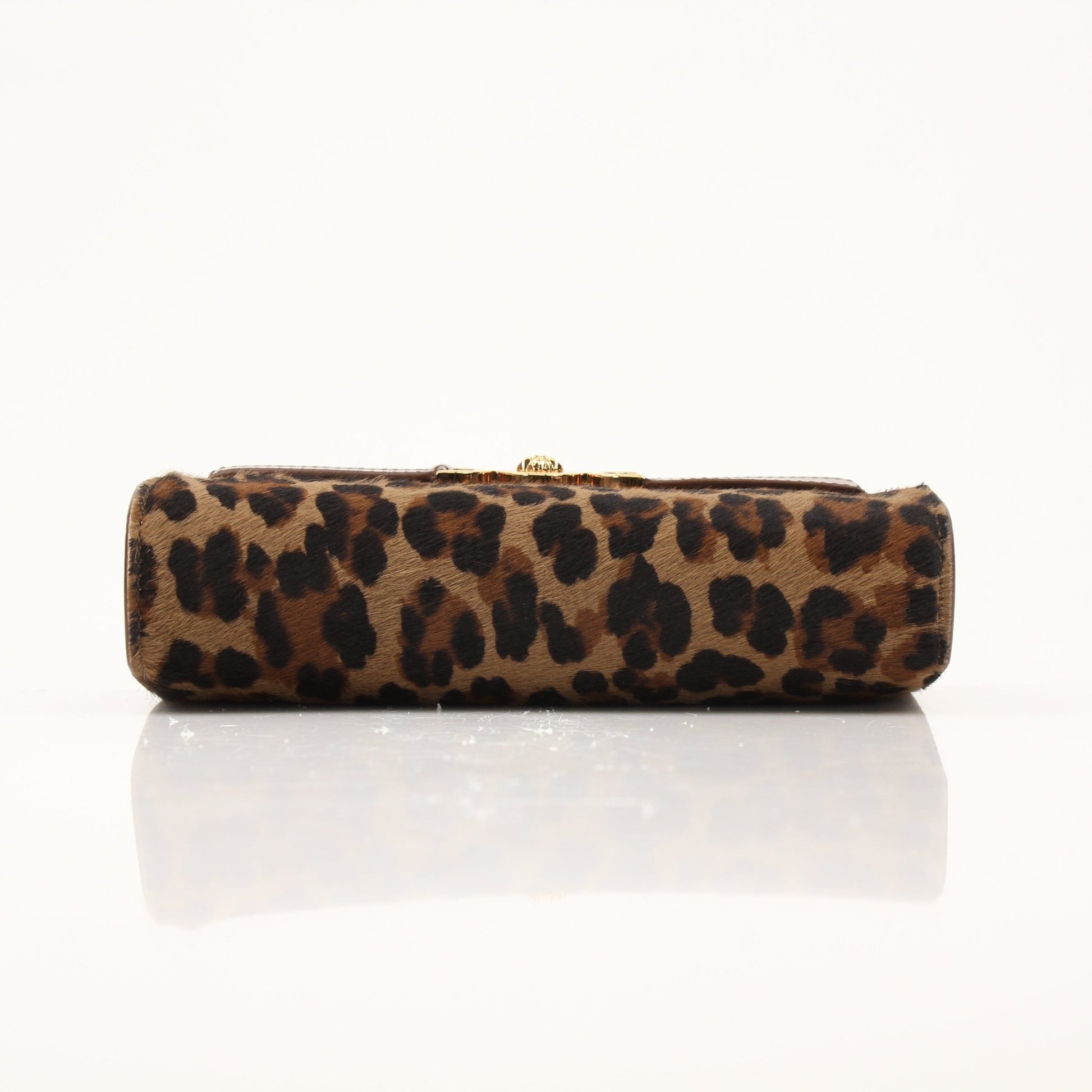 Gold & Beyond Versace leopard pony hair clutch handbag with gold accents and sleek design, perfect for elegant evening outings.