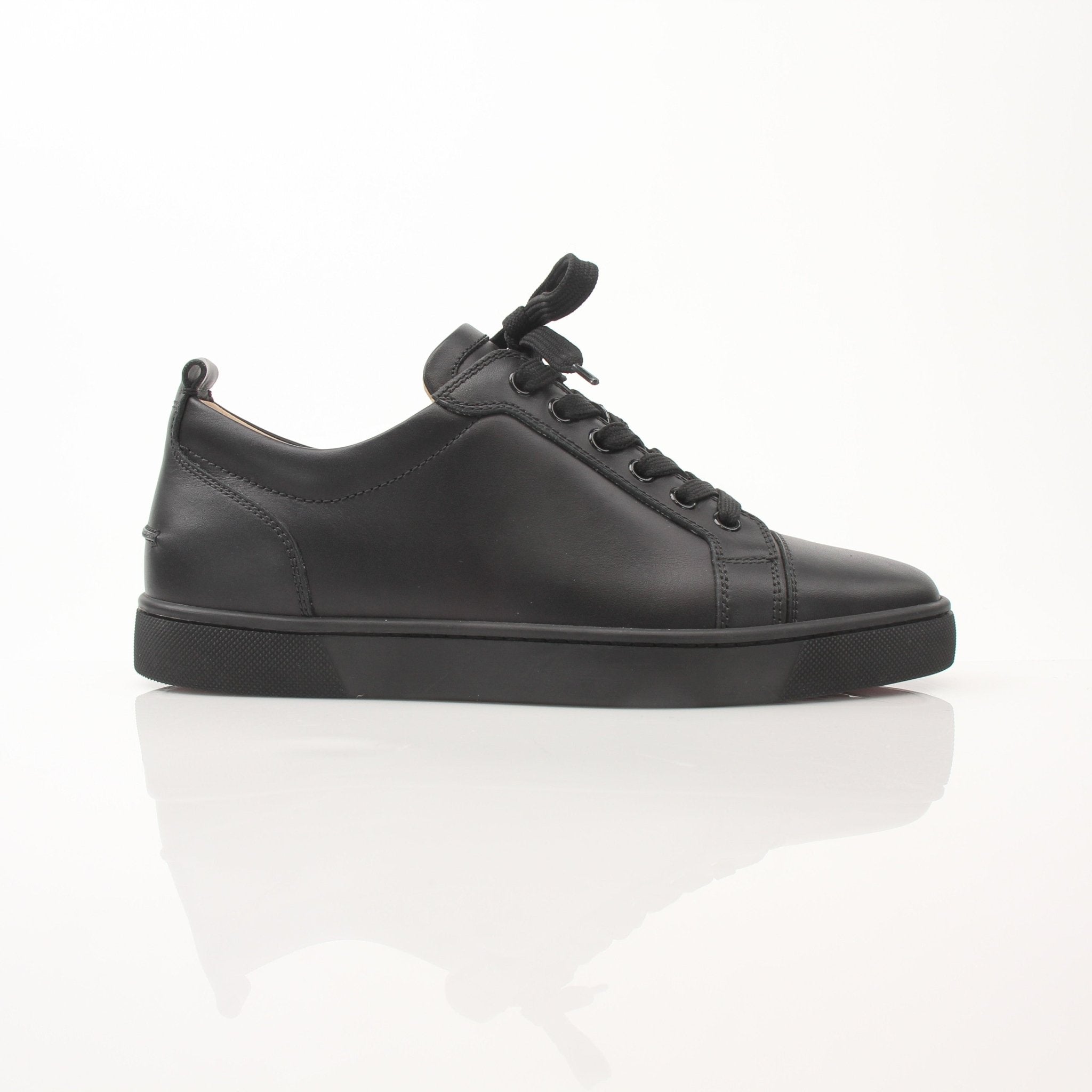 Christian Louboutin Louis Junior sneakers in black with signature red soles, showcasing stylish shoes from Gold & Beyond.