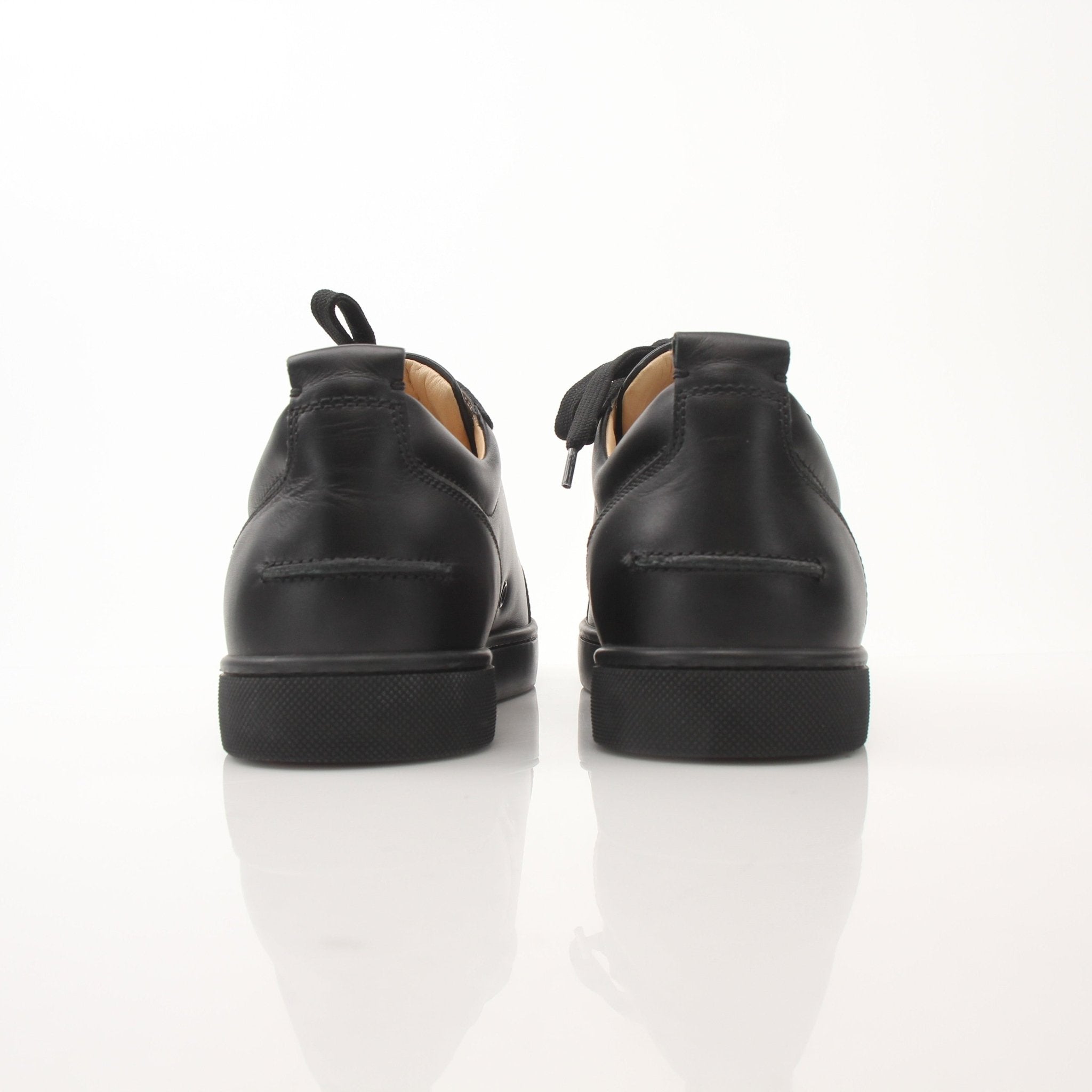 Christian Louboutin Louis Junior sneakers by Gold & Beyond, stylish shoes with signature red soles and sleek design.
