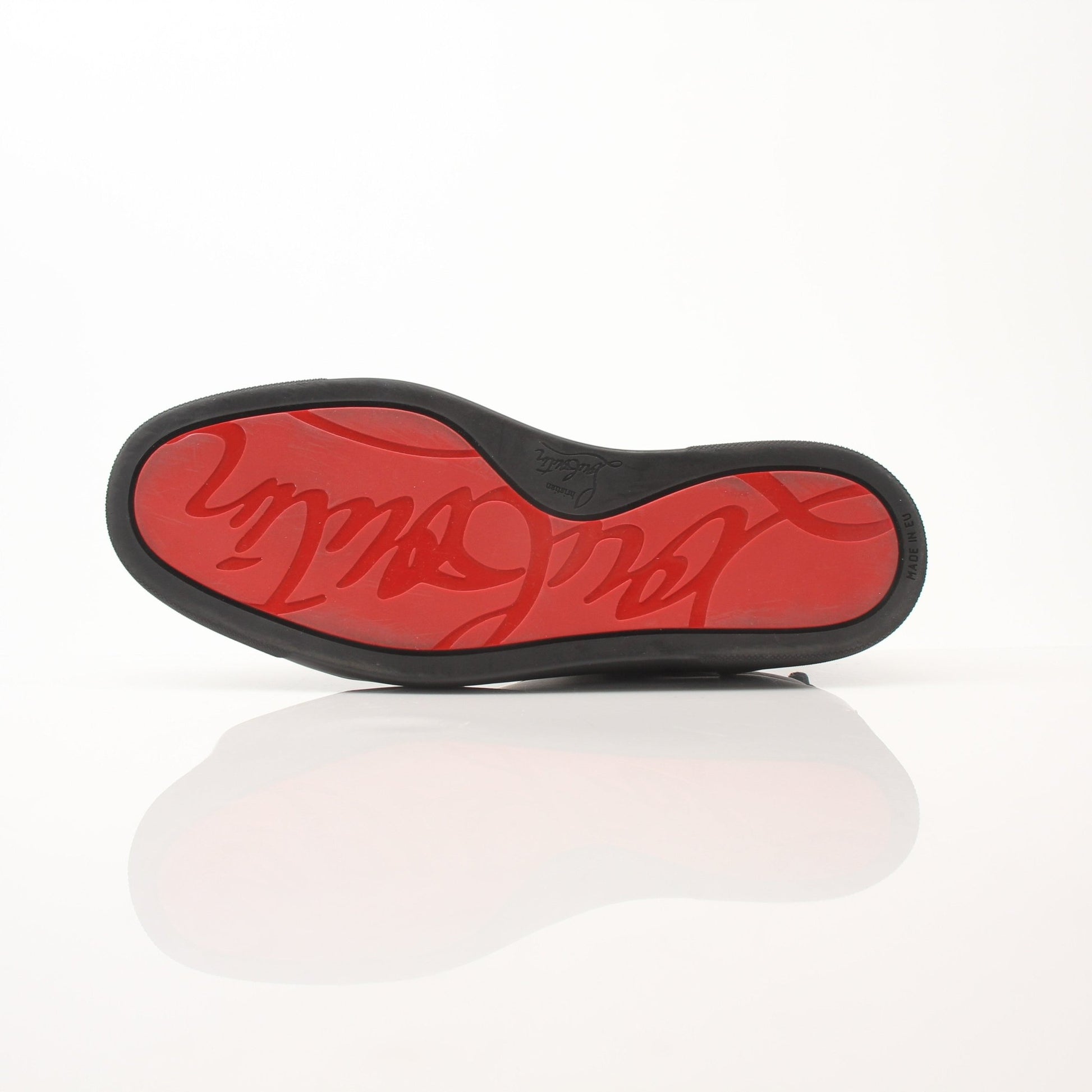 Christian Louboutin Louis Junior sneakers in black with red sole and gold accents, stylish shoes by Gold & Beyond.
