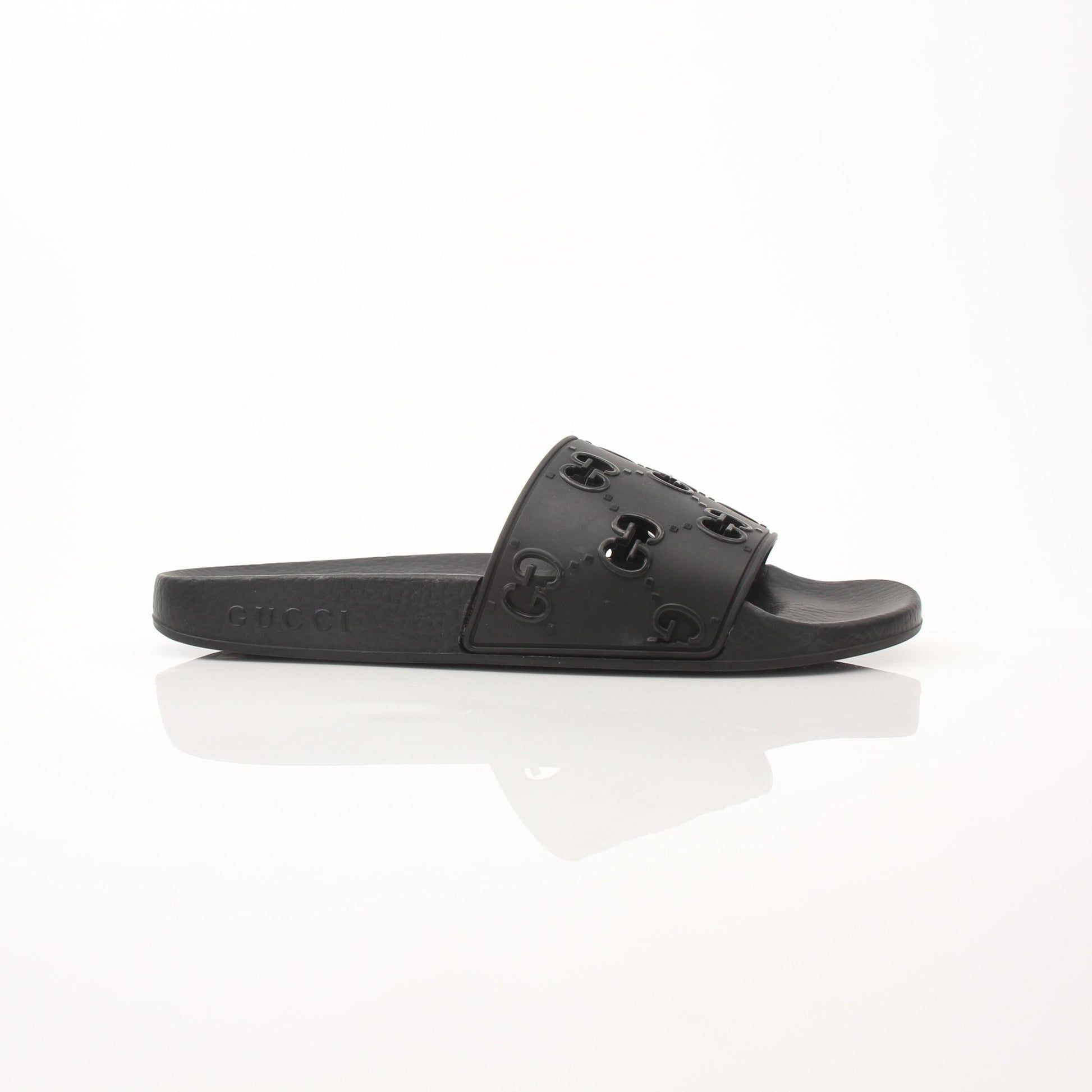 Gold & Beyond Gucci Pursuit Slides shoes with black and gold strap design, casual slip-on footwear for stylish comfort.