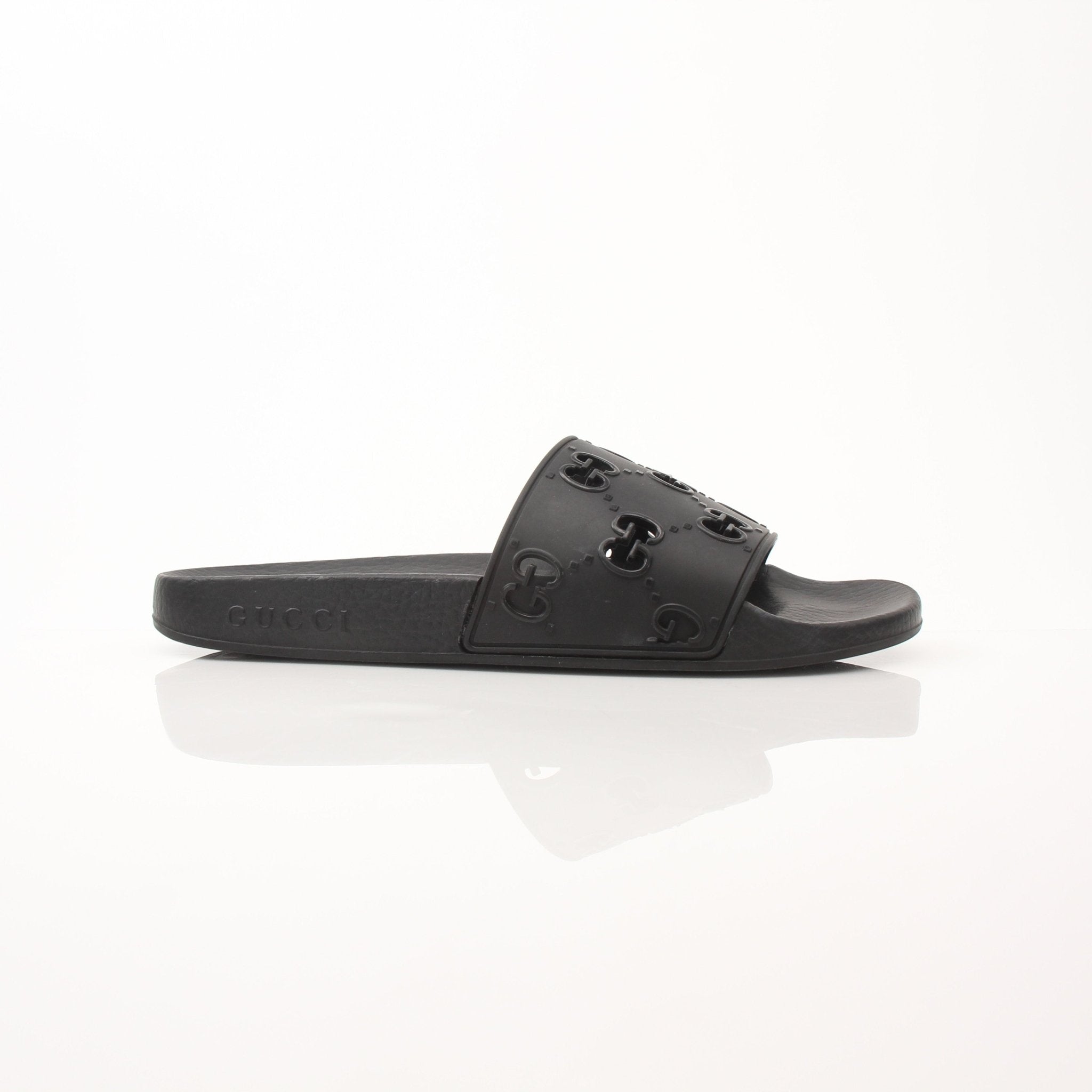 Gold & Beyond Gucci Pursuit Slides shoes with black and gold strap design, casual slip-on footwear for stylish comfort.