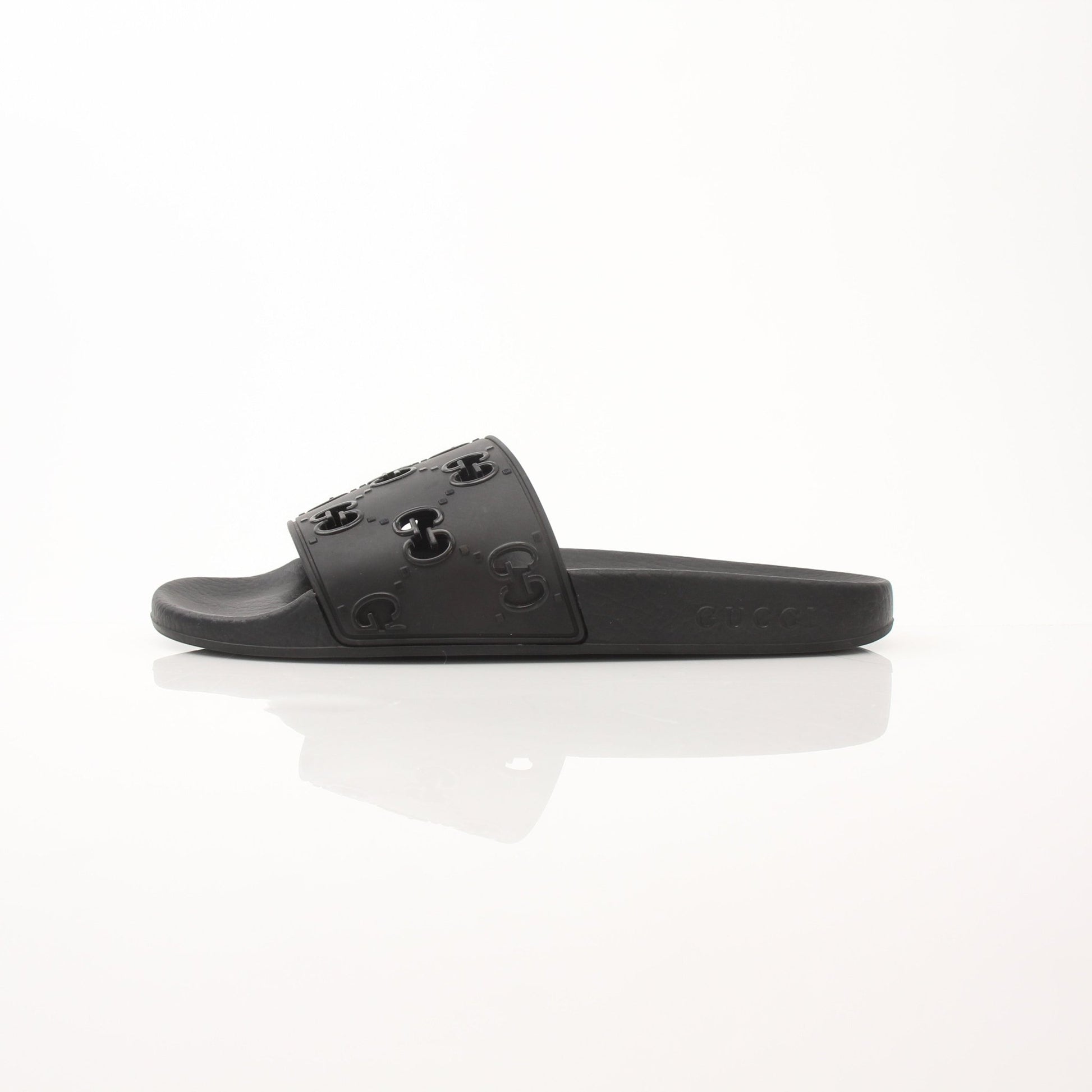 Gold & Beyond Gucci Pursuit Slides shoes, stylish slip-on sandals with Gucci branding and sleek design, suitable for casual wear.