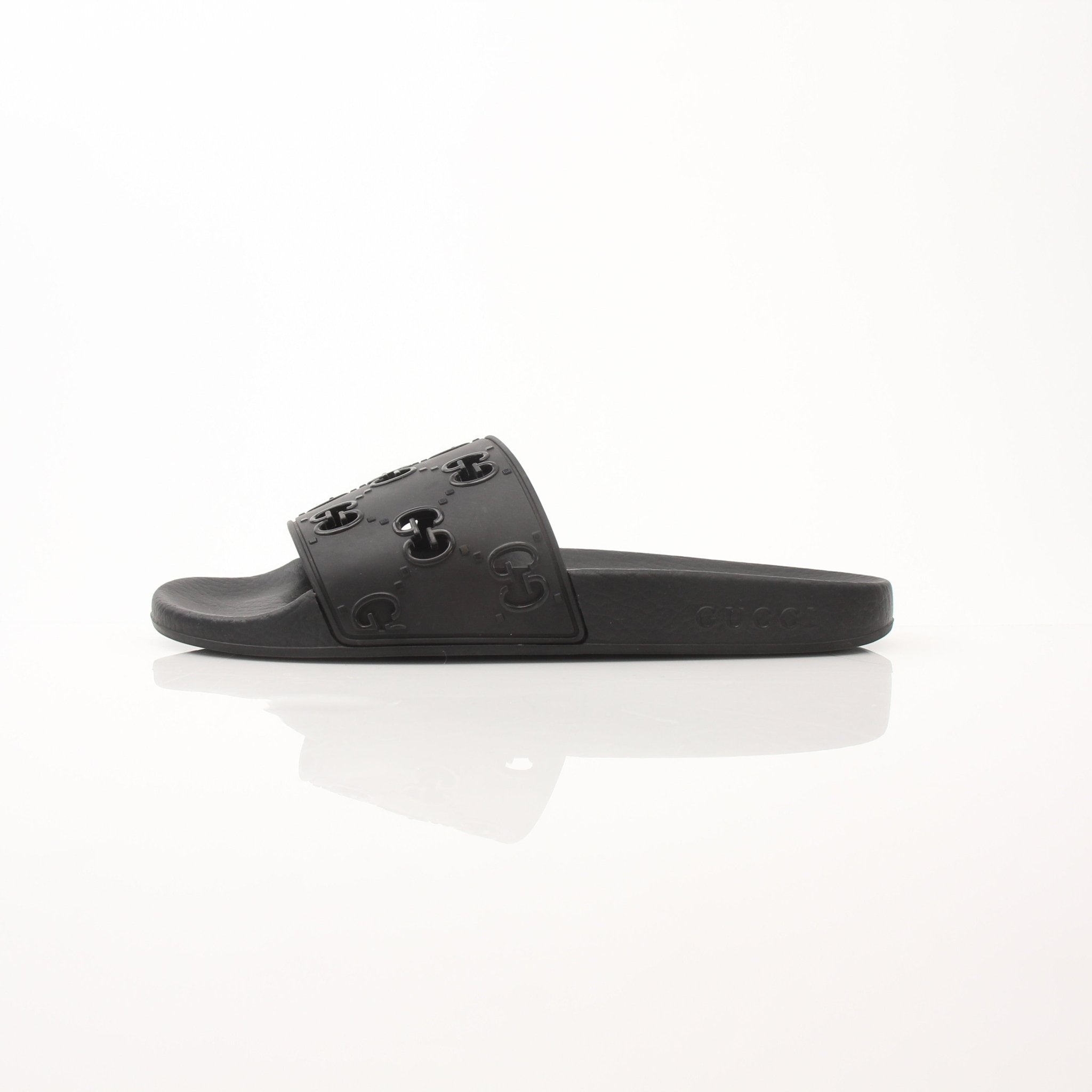 Gold & Beyond Gucci Pursuit Slides shoes, stylish slip-on sandals with Gucci branding and sleek design, suitable for casual wear.