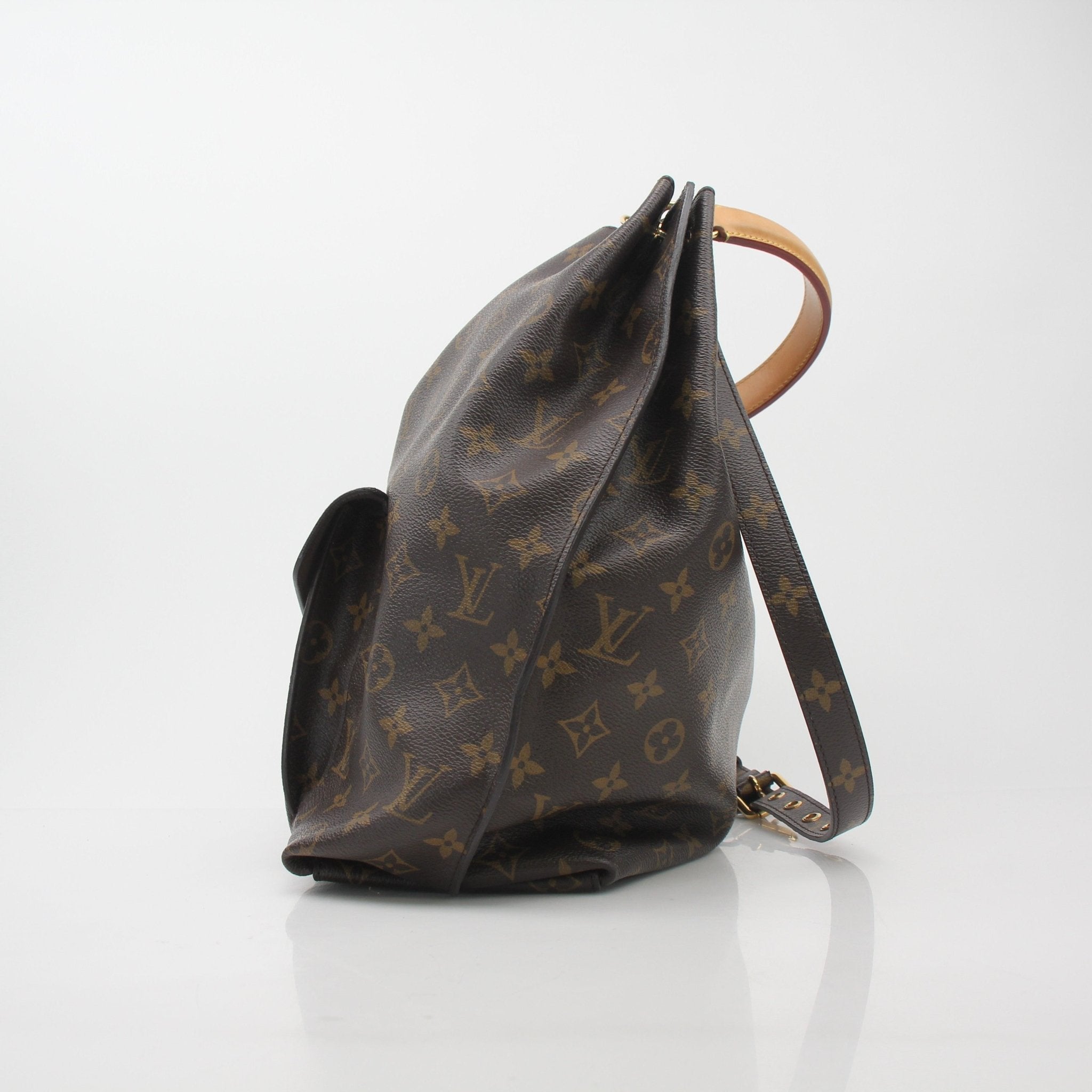 Louis Vuitton Monogram Metis Hobo Bag in brown leather with gold hardware, featuring a spacious design and adjustable strap.