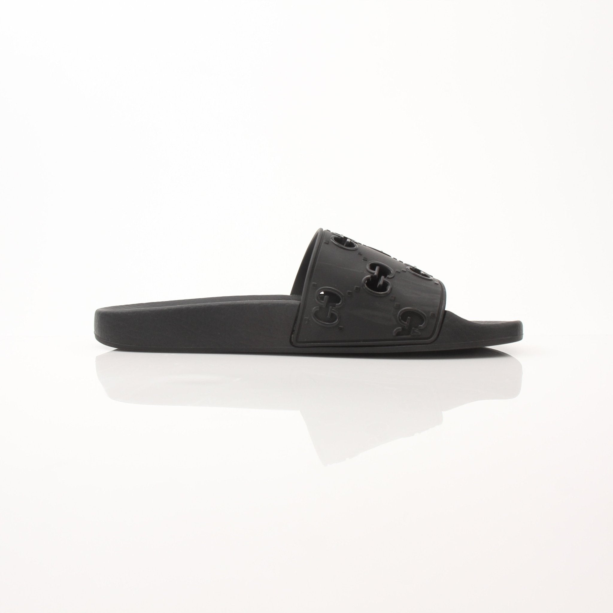 Gold & Beyond Gucci Pursuit Slides shoes featuring sleek design, open-toe style, and branded logo on the straps.