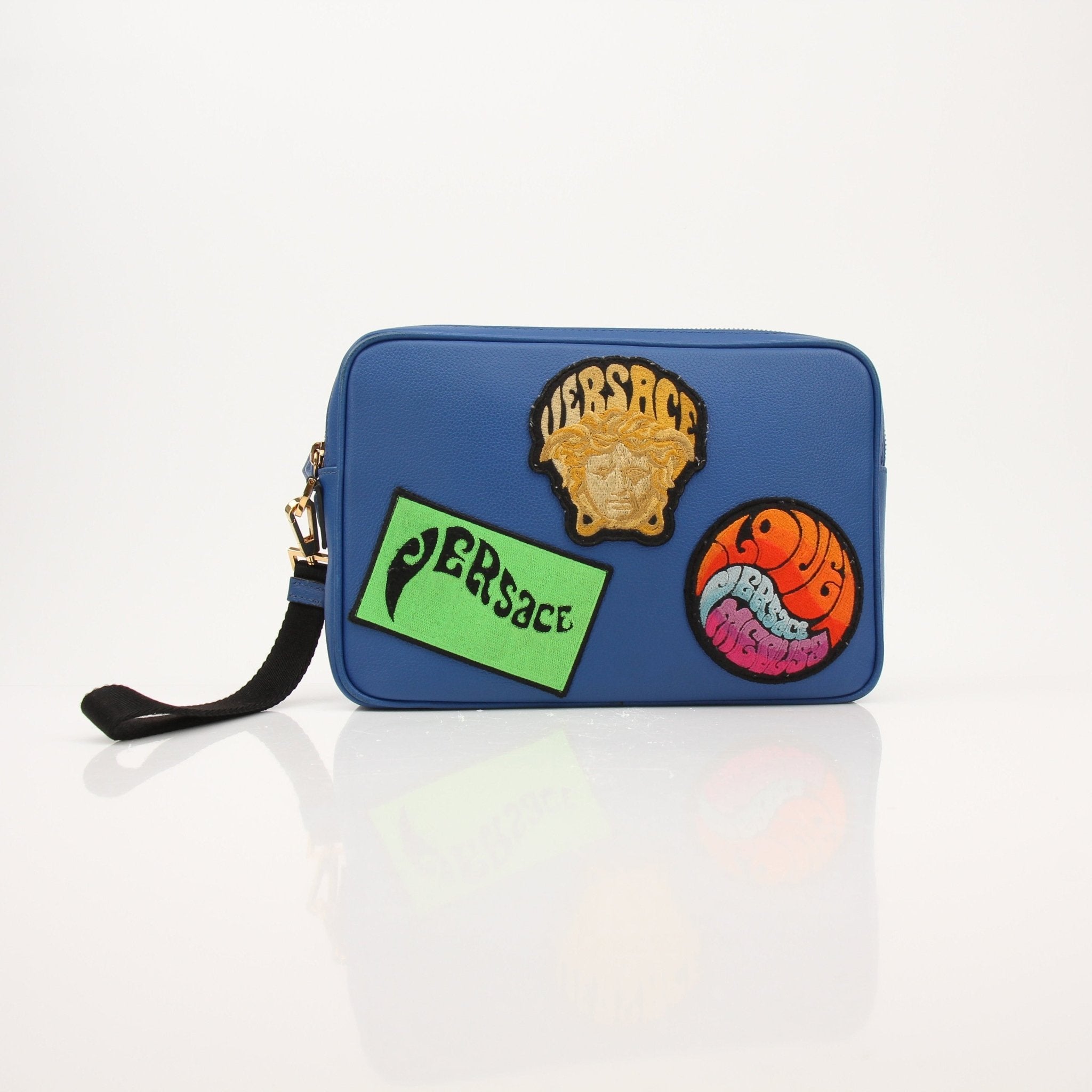 Large blue Versace men's wristlet handbag with gold accents, featuring a sleek design and textured material.