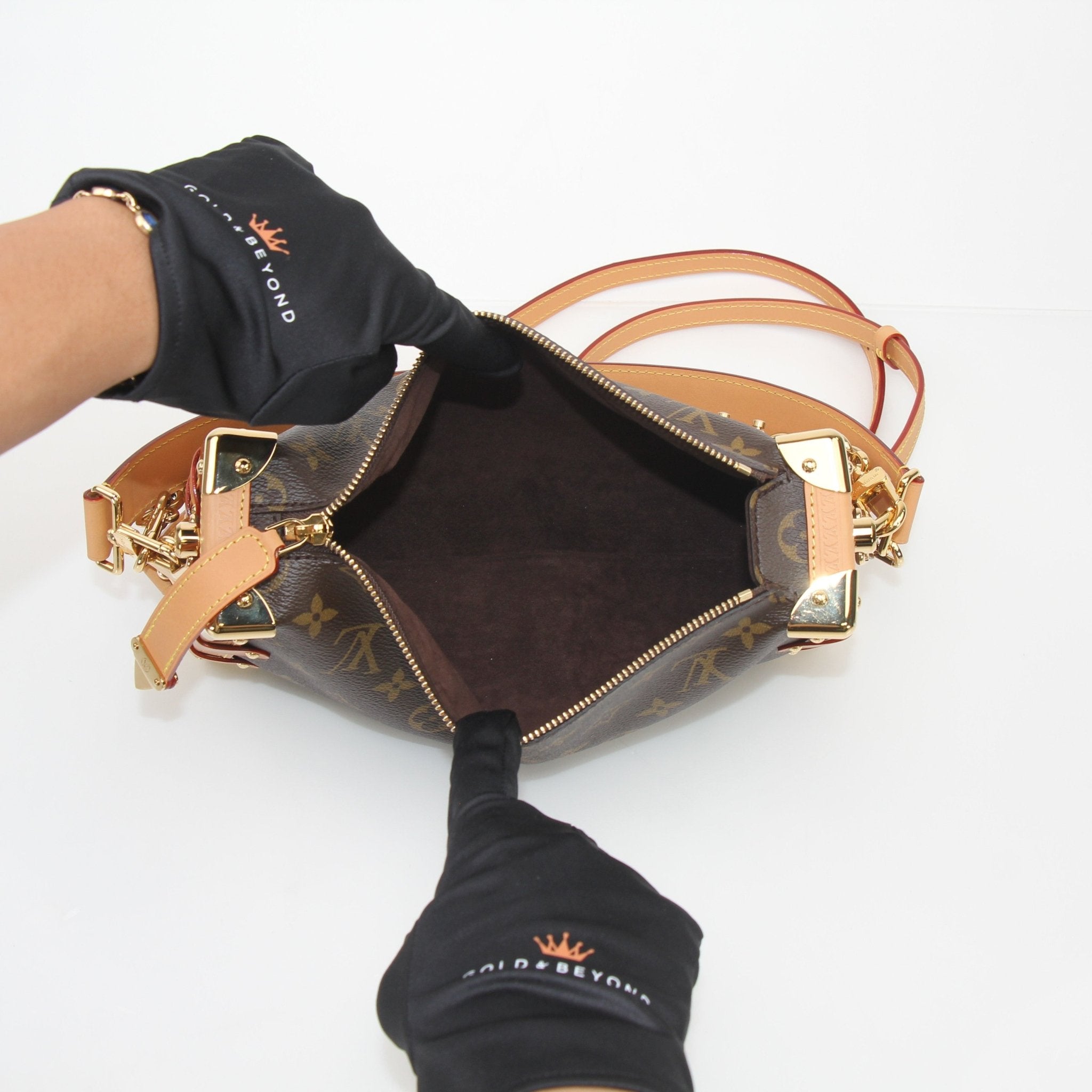 Louis Vuitton Monogram Side Trunk MM crossbody handbag with leather accents and adjustable strap, displayed on a plain background.