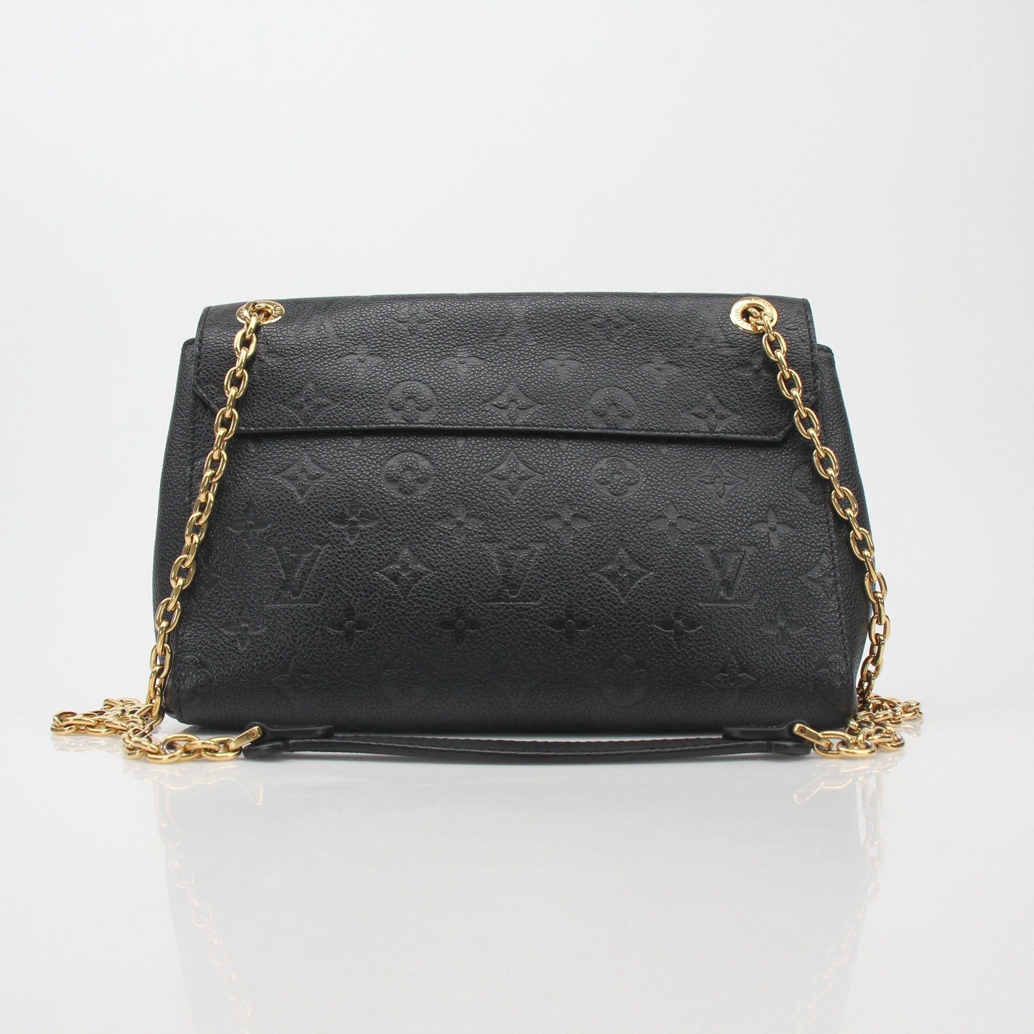 Louis Vuitton Black Monogram Empreinte Vavin MM shoulder handbag with gold hardware and leather strap.