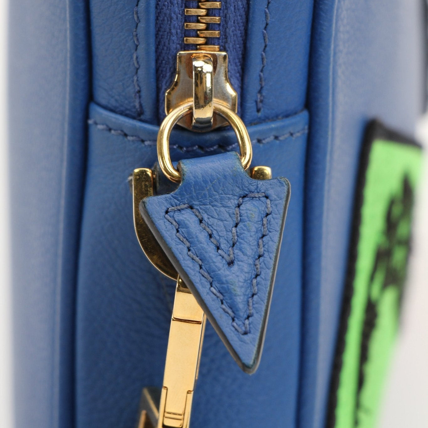 Large blue Versace men's wristlet handbag with gold accents, featuring a sleek design and compact size for everyday use.