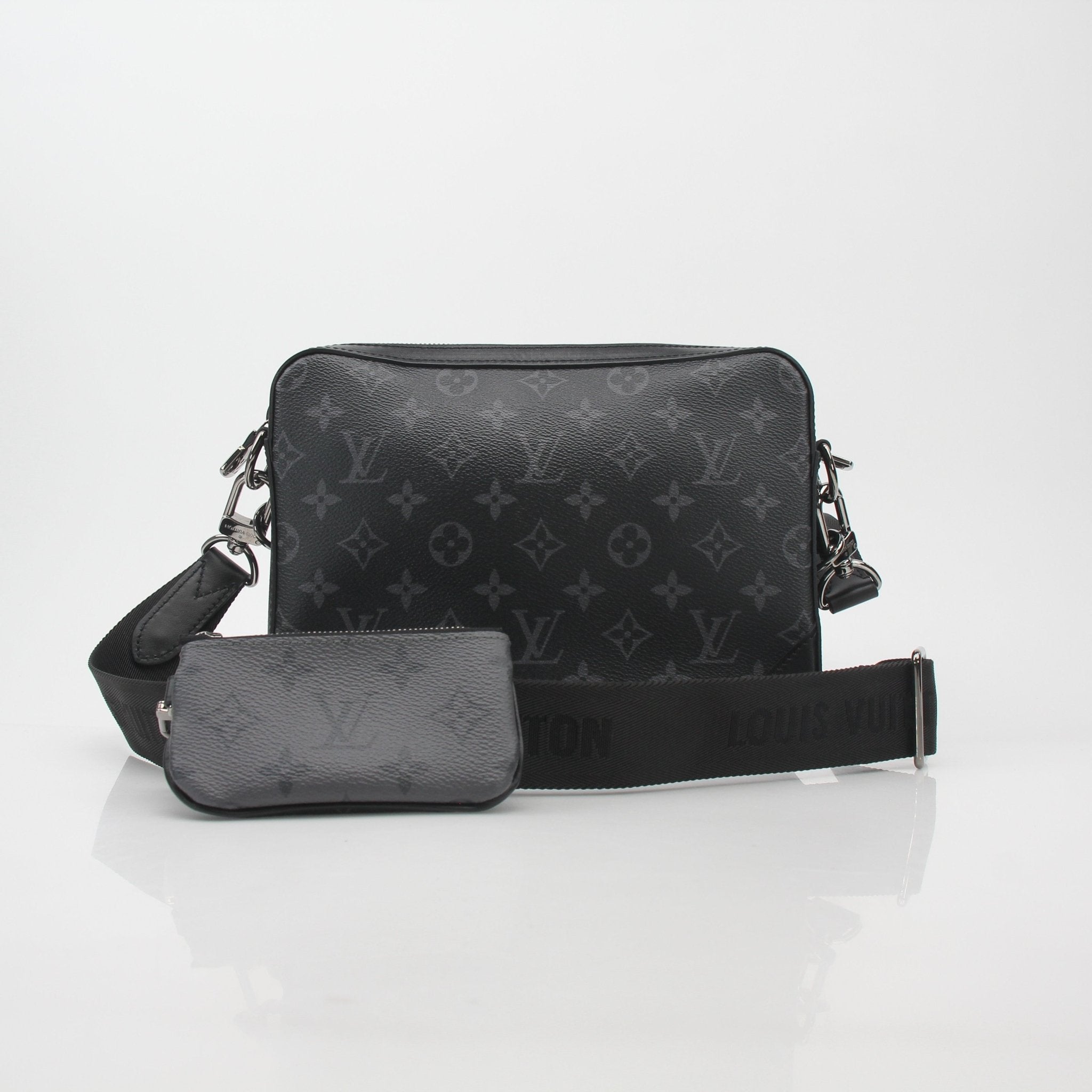 Louis Vuitton Monogram Eclipse Trio Messenger Bag handbag with gold accents and adjustable strap, featuring signature LV Monogram pattern.