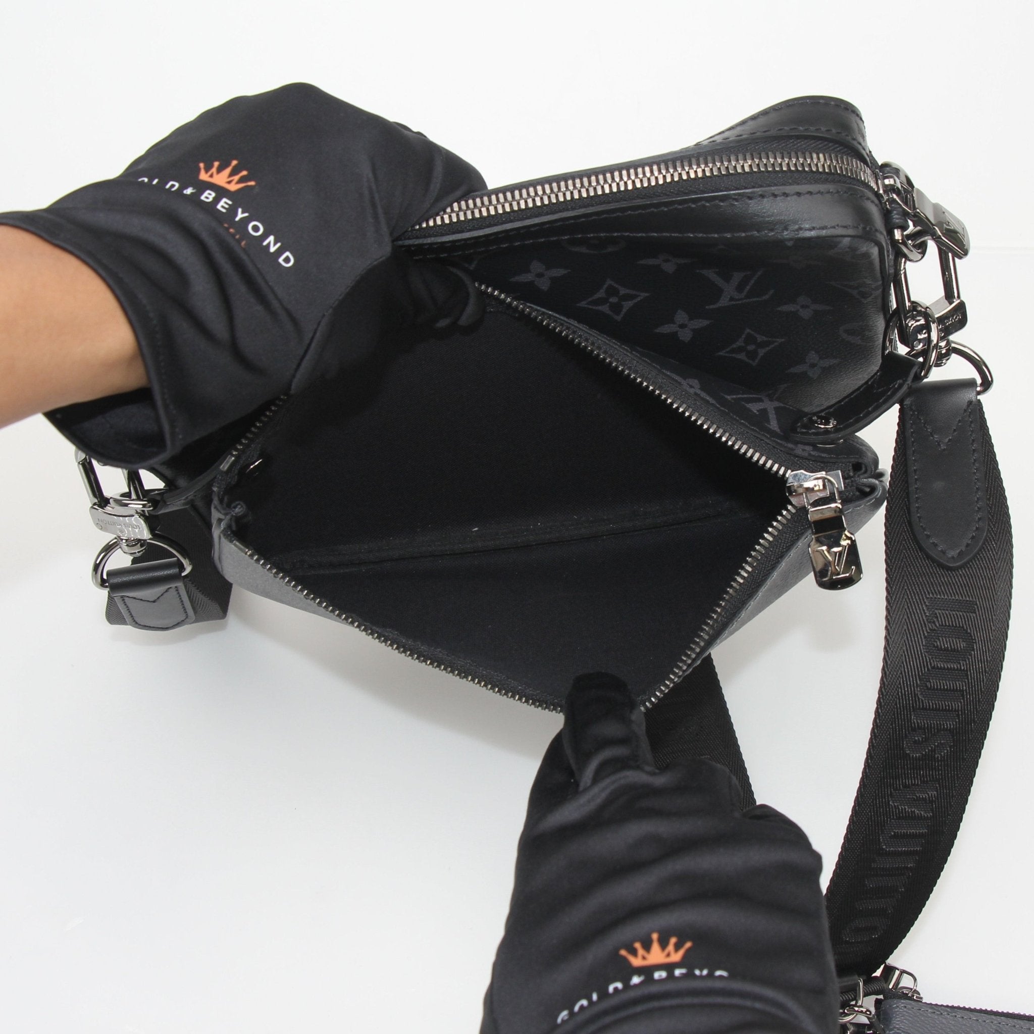 Louis Vuitton Monogram Eclipse Trio Messenger Bag handbag with adjustable strap and signature monogram pattern, black and gray tones.