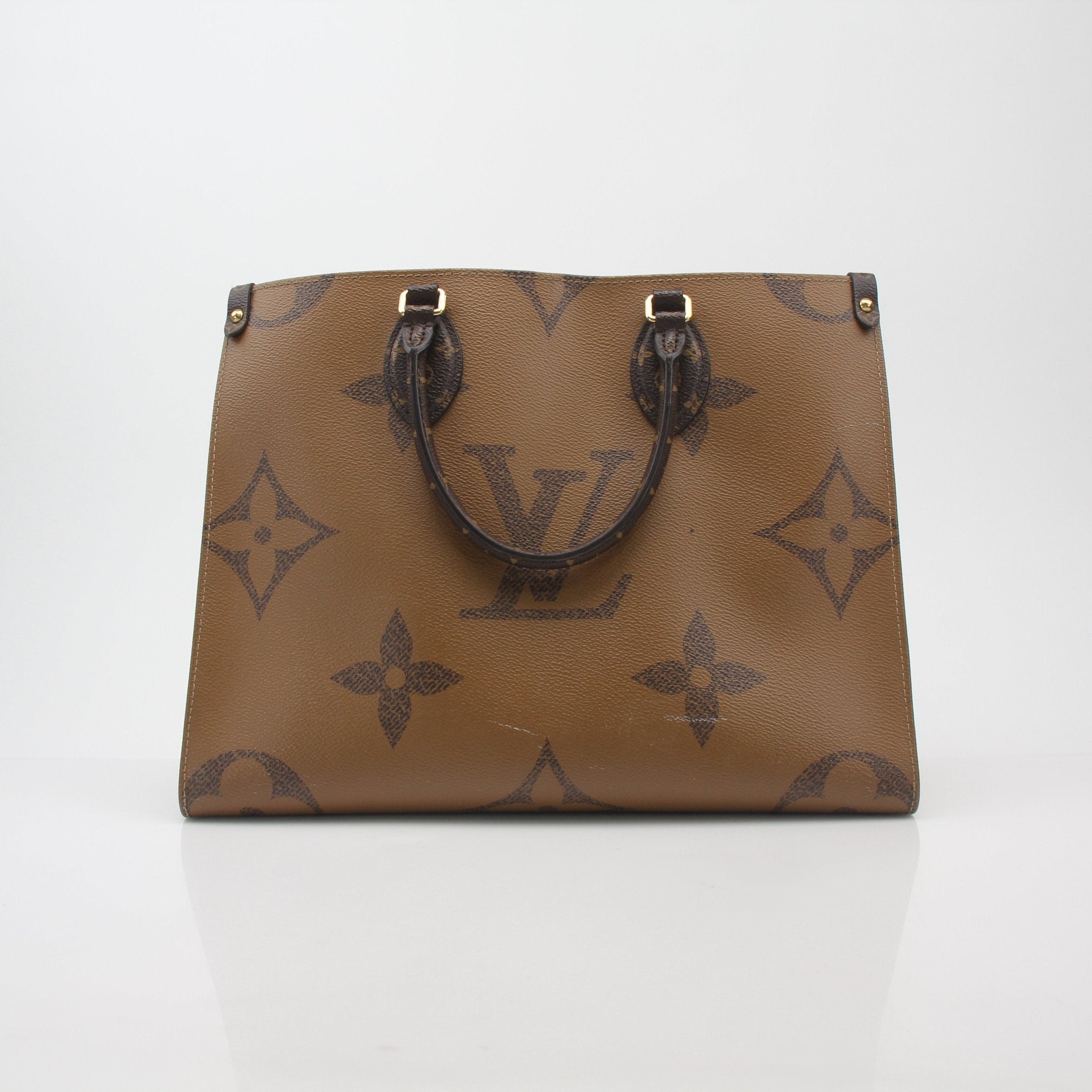 Louis Vuitton Giant Monogram Reverse OnTheGo MM tote bag by Gold & Beyond, showcasing the spacious handbag with monogram design.