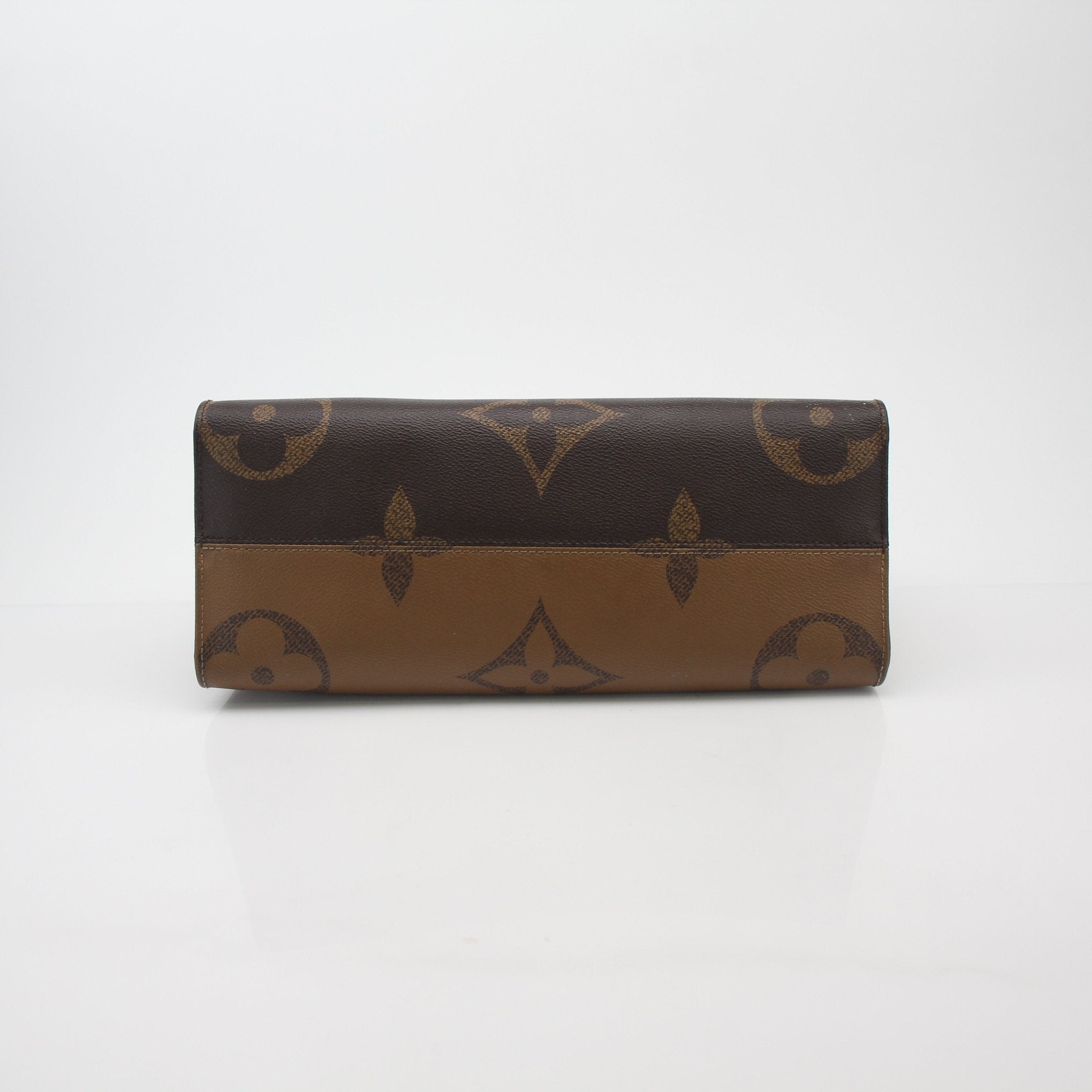 Louis Vuitton Giant Monogram Reverse OnTheGo MM tote handbag with dual handles and gold-tone hardware, featuring monogram canvas.