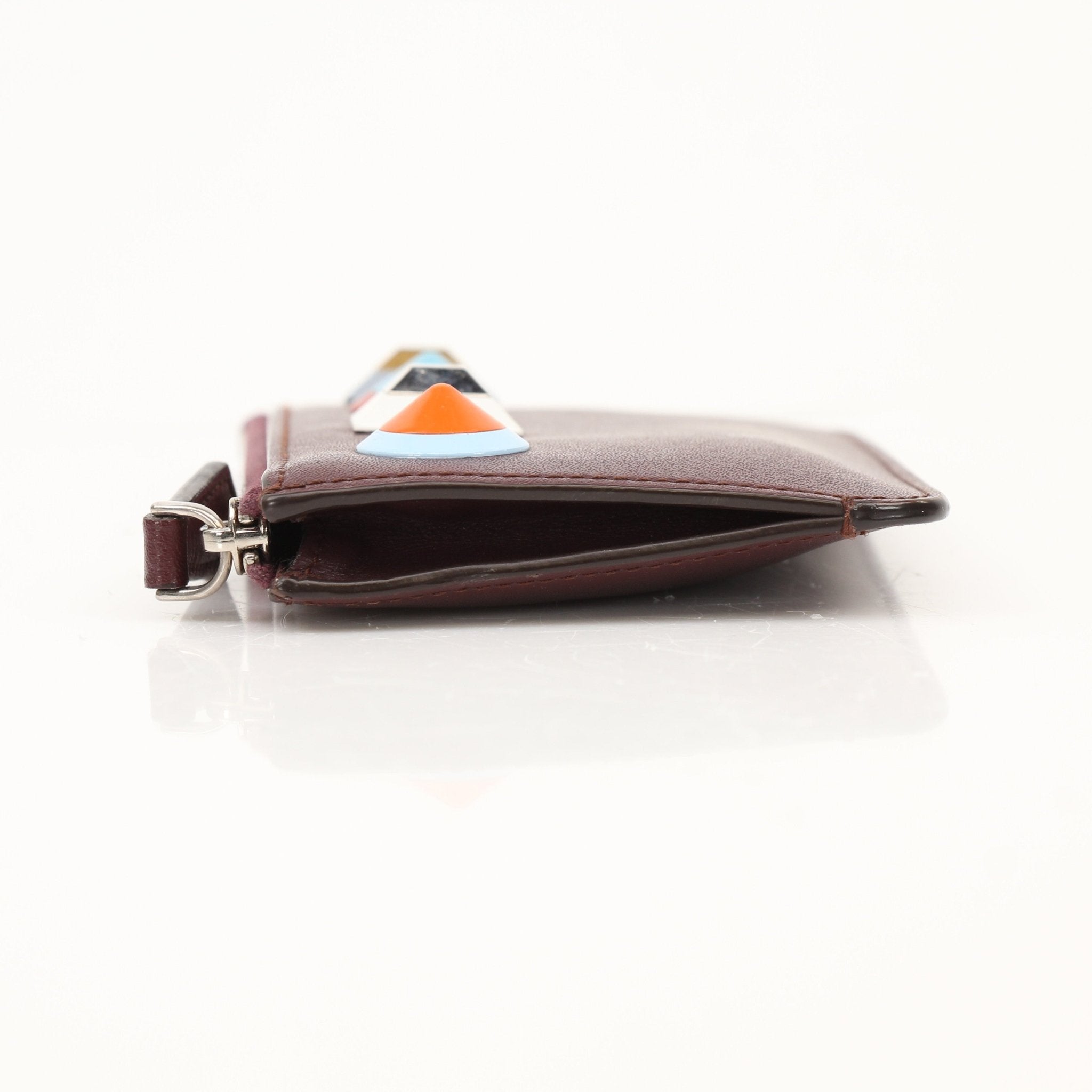 Purple Fendi keychain pouch wallet with gold accents, featuring a compact design and luxurious leather finish.