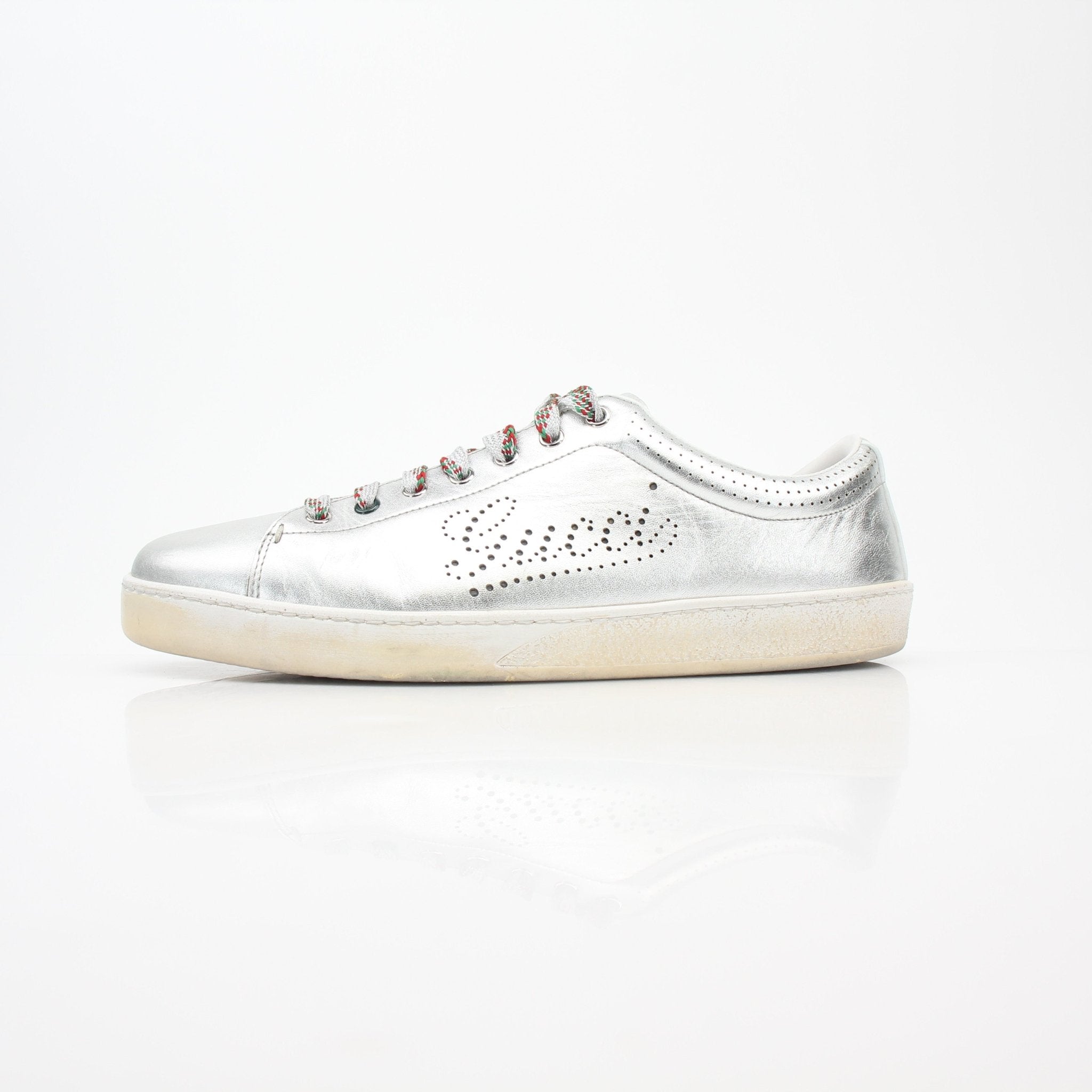 Silver Gucci Ace perforated logo sneakers with metallic finish and white rubber soles, stylish shoes from Gold & Beyond.
