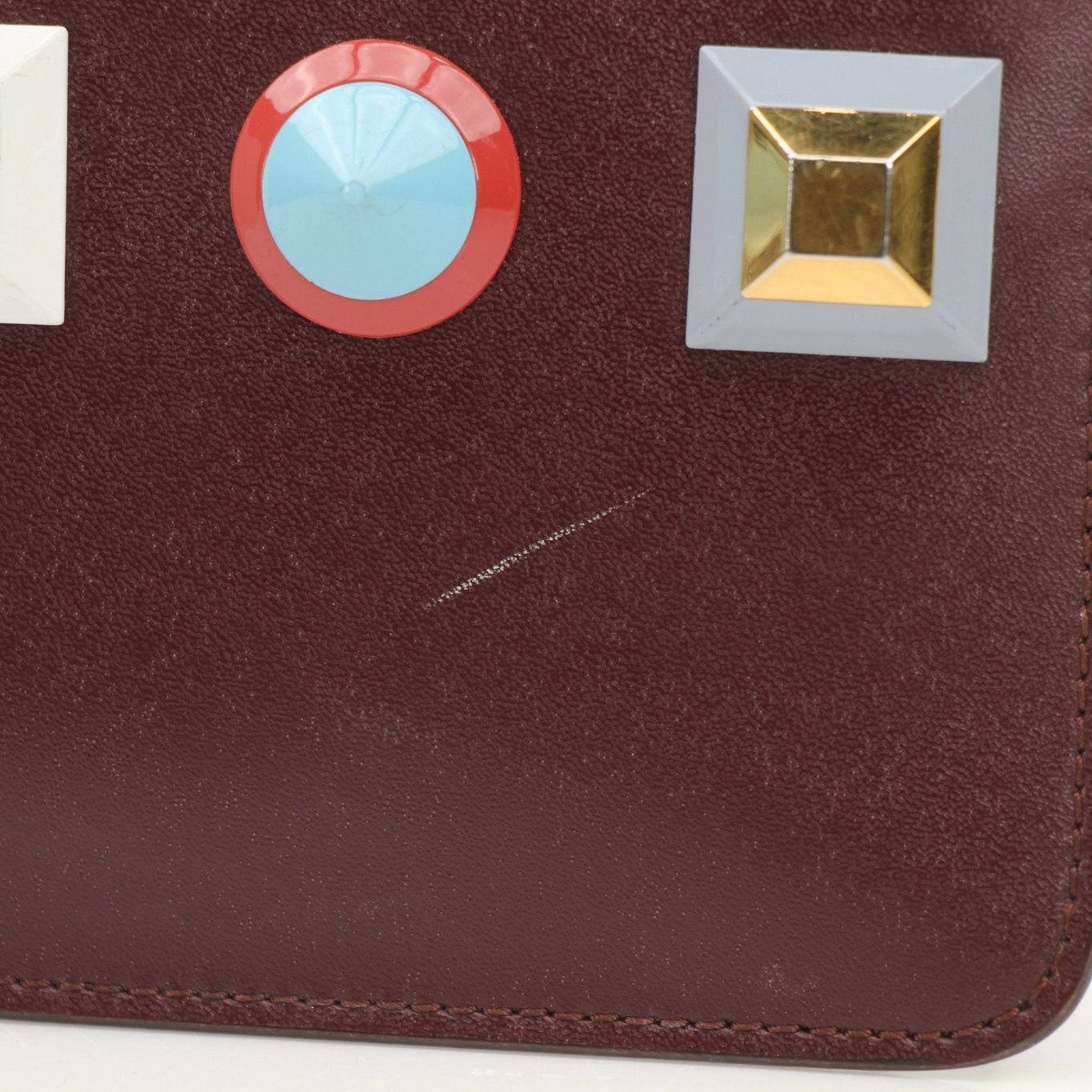 Purple Fendi keychain pouch wallet with gold accents, featuring a compact design and branded logo.