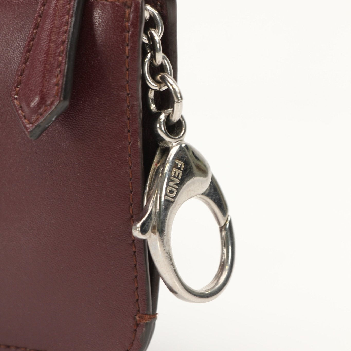 Purple Fendi keychain pouch wallet with gold accents, featuring the Fendi logo and a compact design for easy carrying.