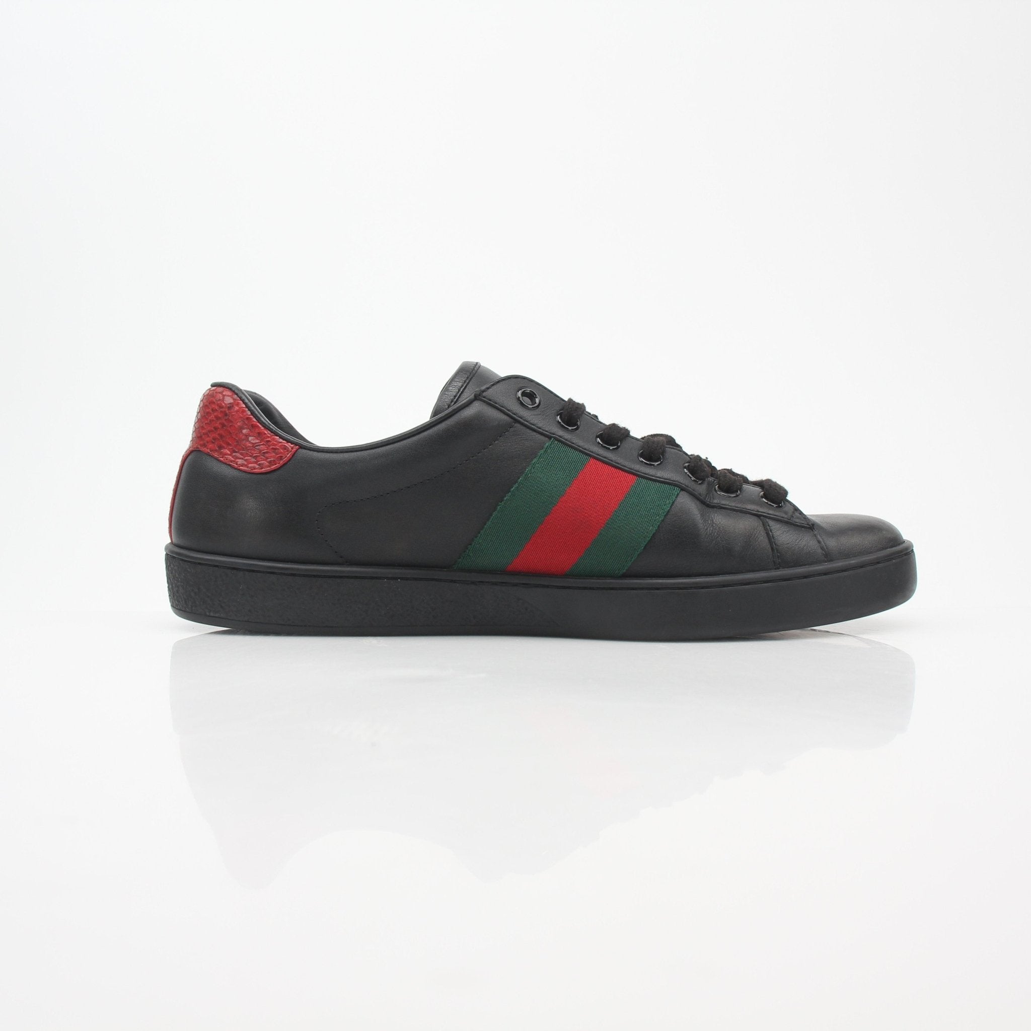 Gucci Black Ace Web low-top sneakers with signature side stripe and white sole, casual shoes for stylish everyday wear.
