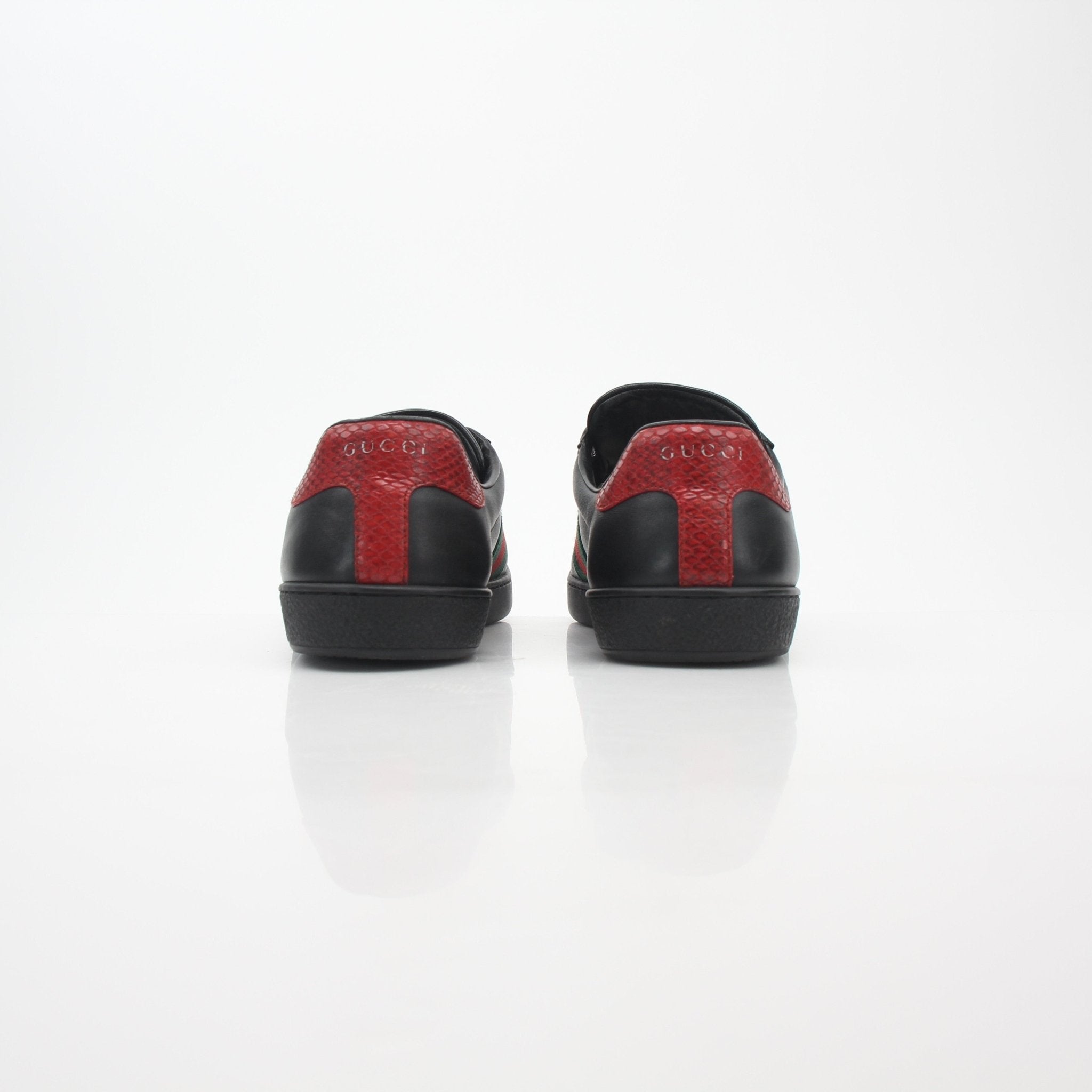 Gucci Black Ace Web low-top sneakers with signature design, featuring black leather and iconic web stripe detail.