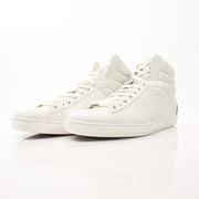 Gold & Beyond Gucci Ace high top sneakers, stylish shoes with white canvas and signature green and red stripe details.