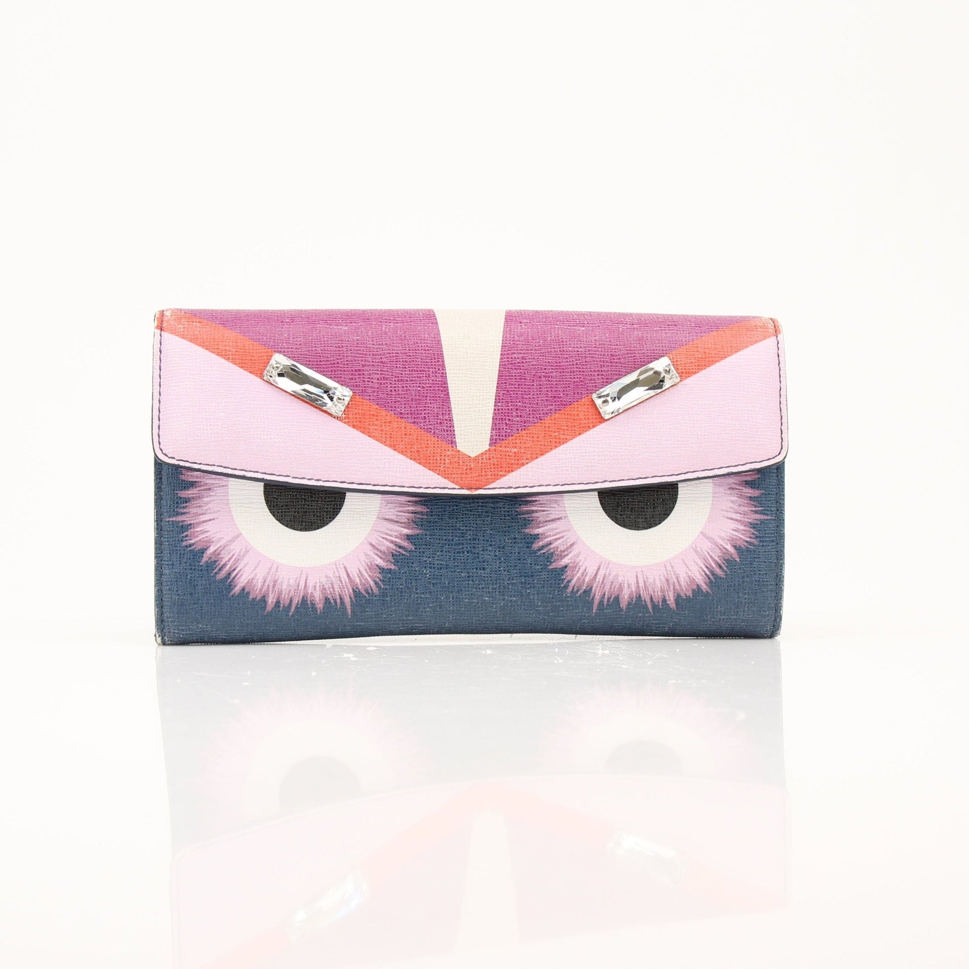 Fendi Monster Continental wallet with gold-tone hardware, featuring signature monster motif and multiple card slots.