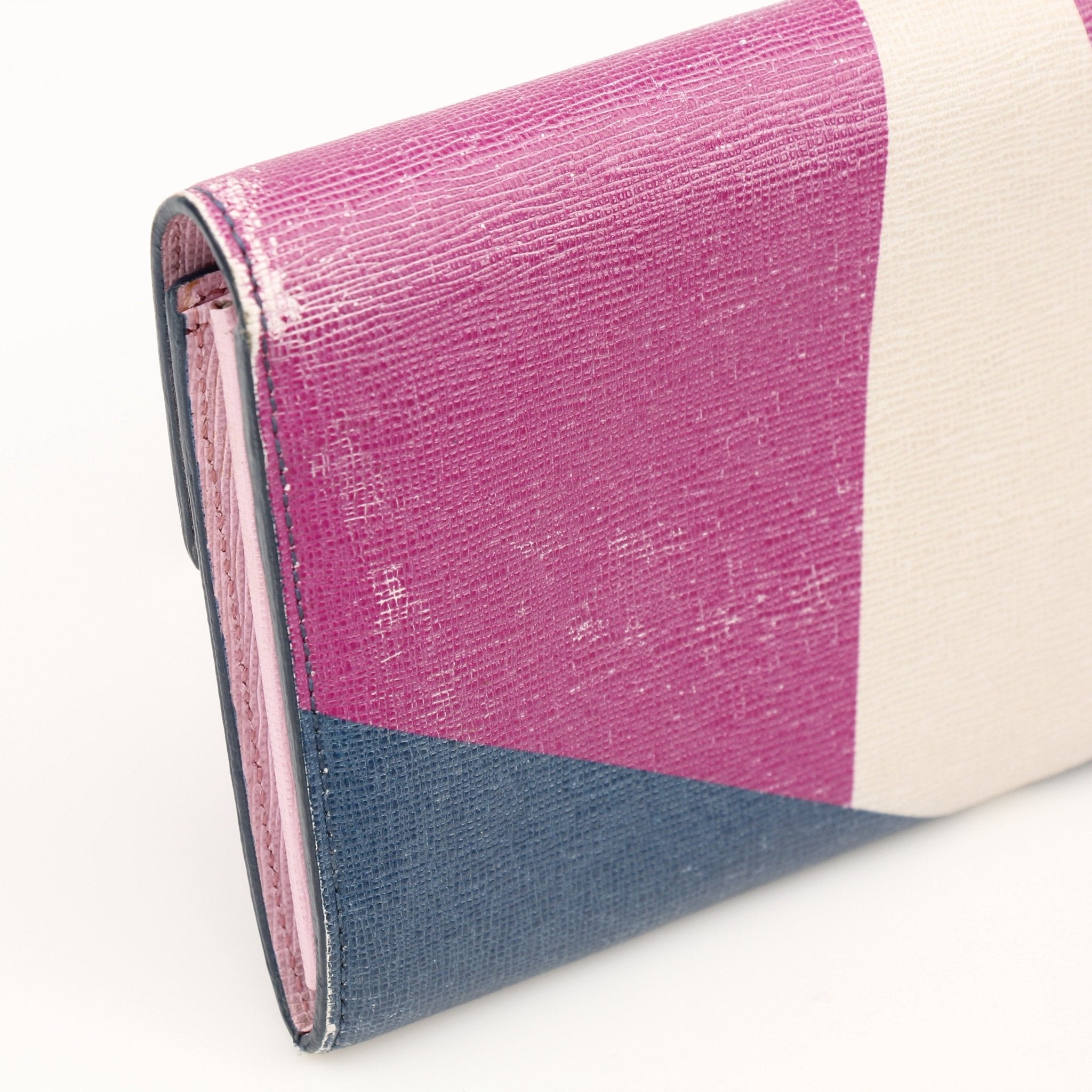 Fendi Monster Continental Wallet by Gold & Beyond featuring the iconic monster design and multiple card slots in a sleek wallet style.