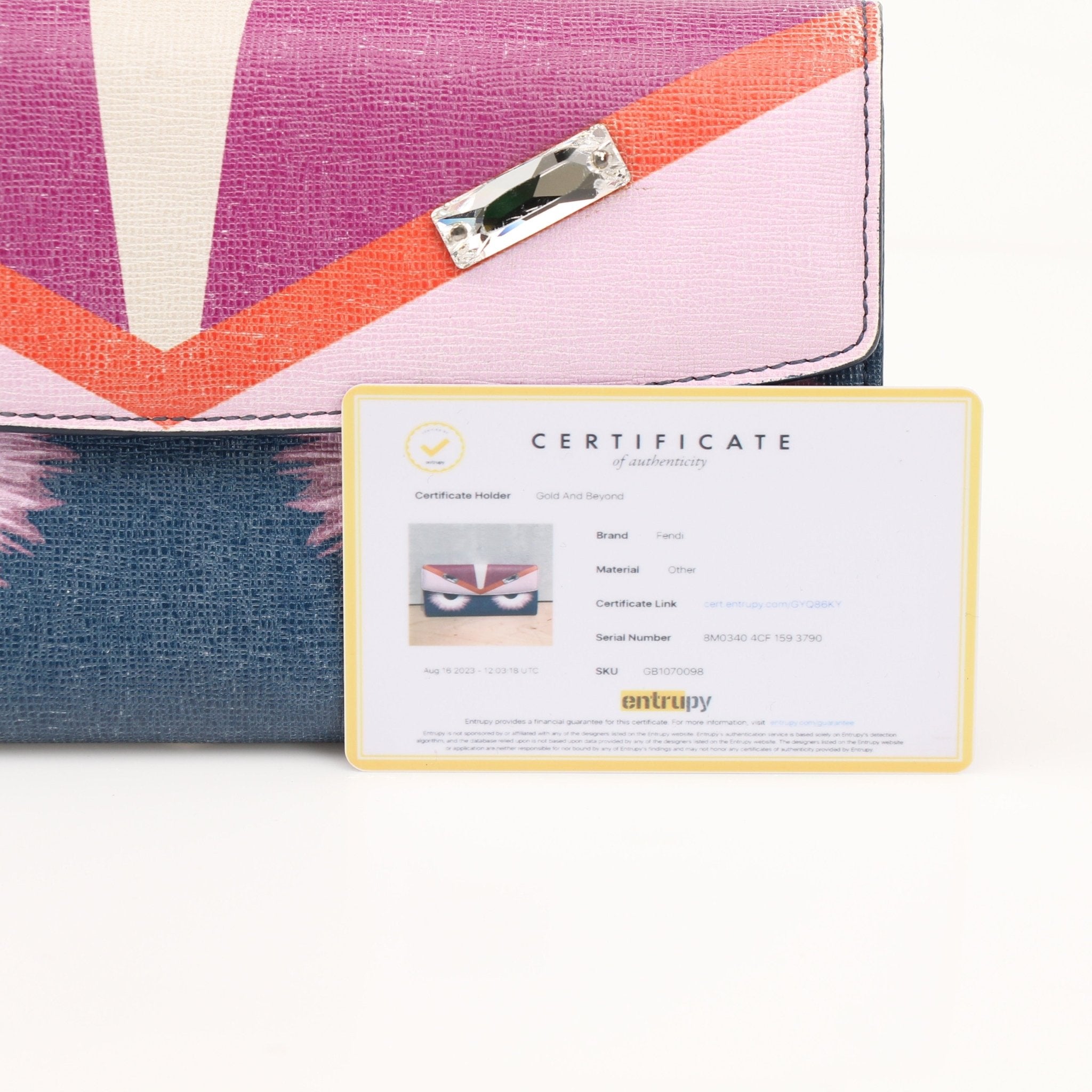 Fendi Monster Continental Wallet by Gold & Beyond featuring signature monster design, leather construction, and multiple card slots.