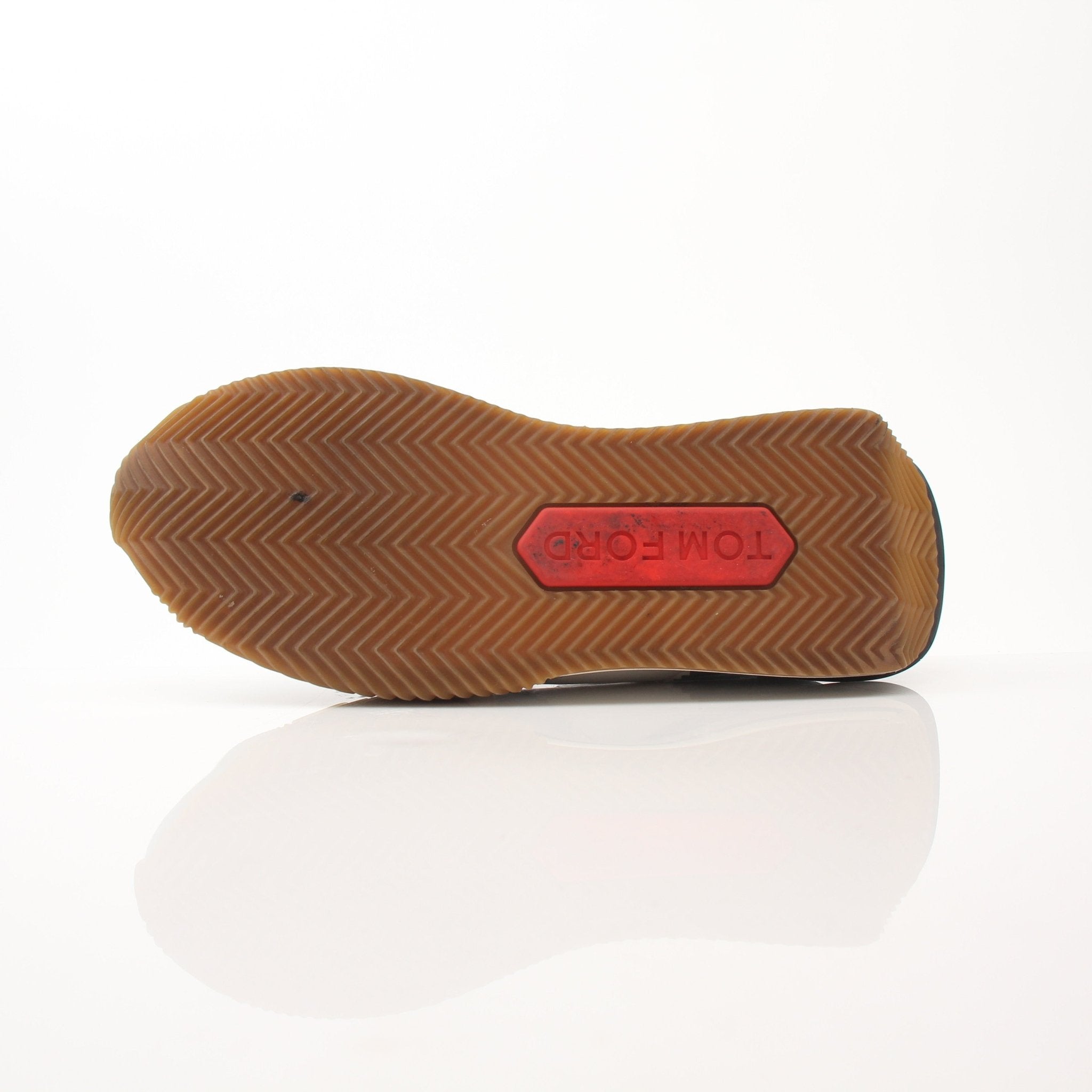 Tom Ford trainers shoes featuring sleek design and stylish detailing, worn on feet with casual clothing.