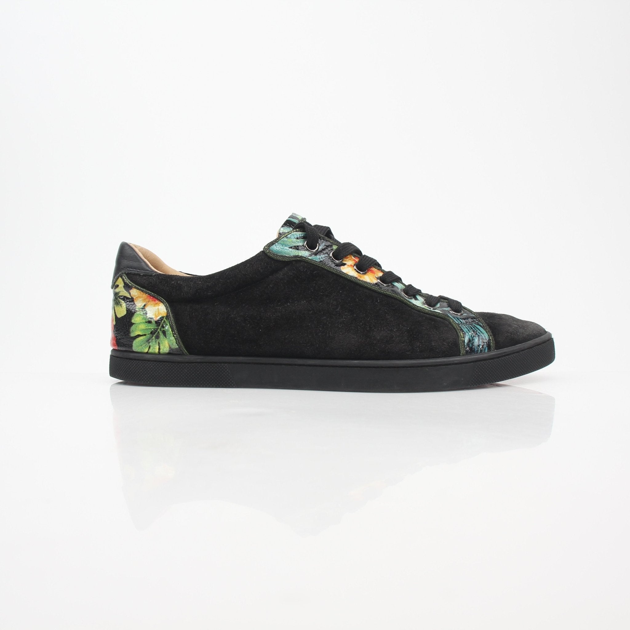 Christian Louboutin Black Louis Junior Floral low-top sneakers with colorful floral accents and signature red sole detail.