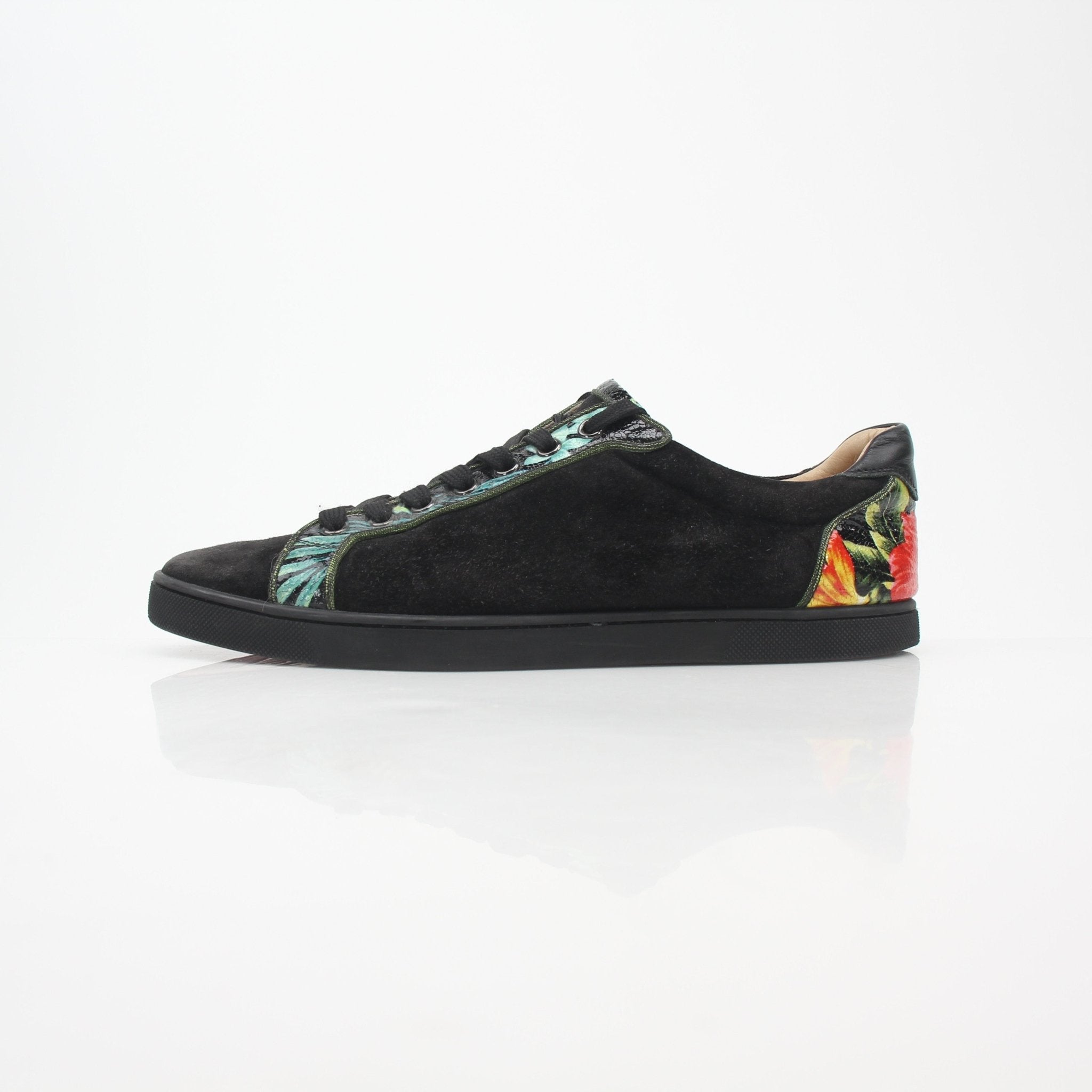 Christian Louboutin Black Louis Junior floral low-top sneakers with colorful flower embroidery and sleek shoe design.