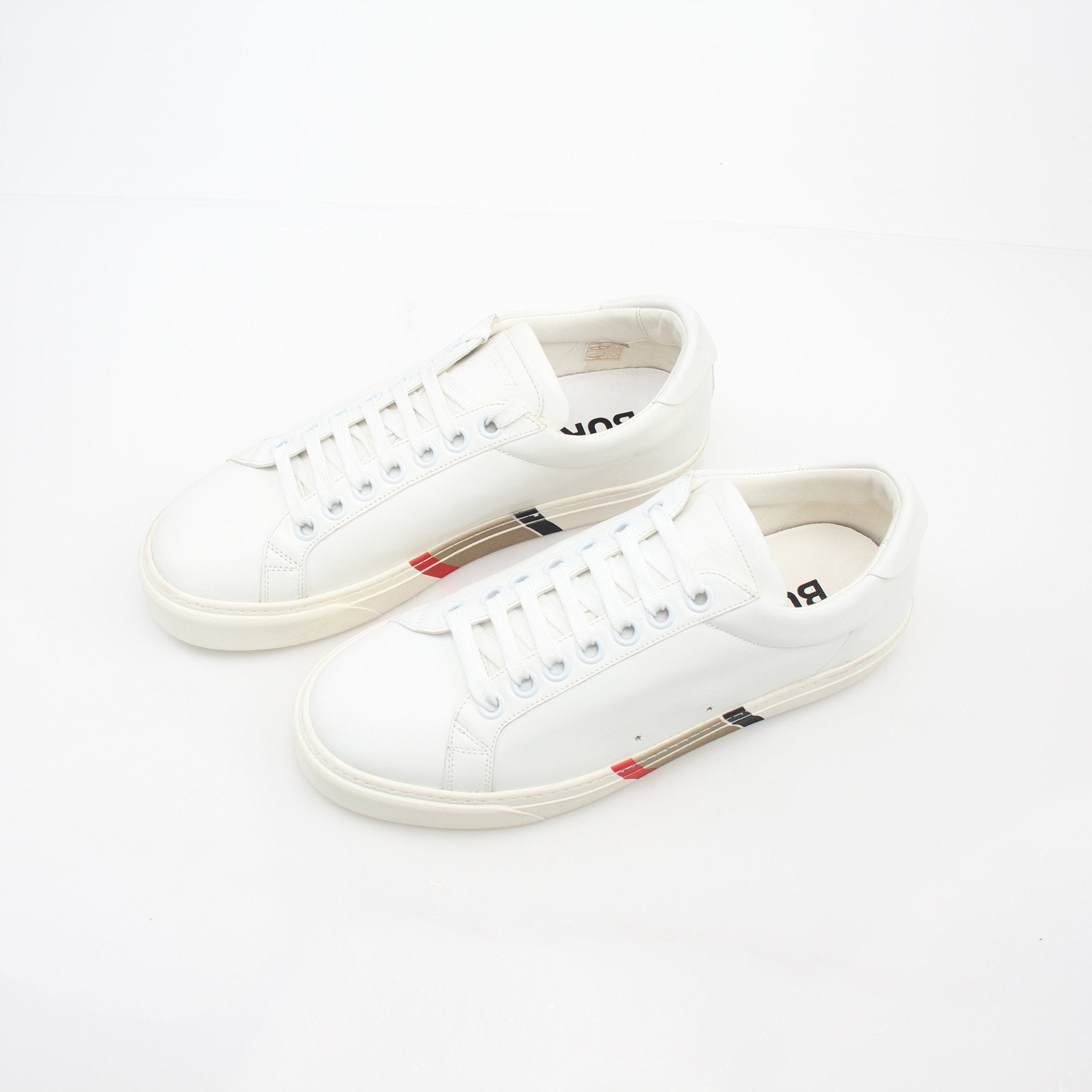 Gold & Beyond white Burberry Rangleton low-top sneakers with stylish design and durable soles, perfect for casual wear.