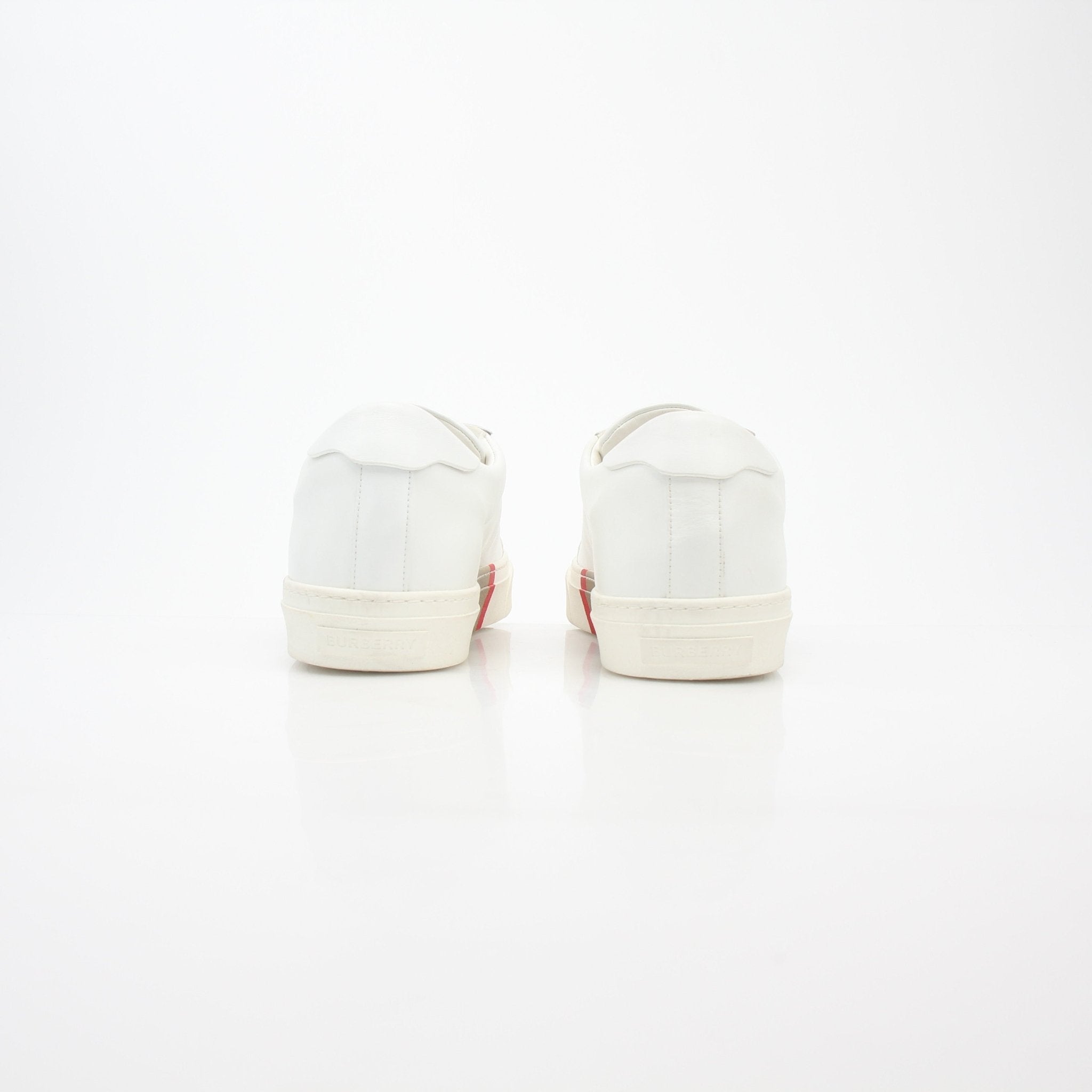 Gold & Beyond white Burberry Rangleton low-top sneakers with sleek design and white leather upper, perfect for casual wear.