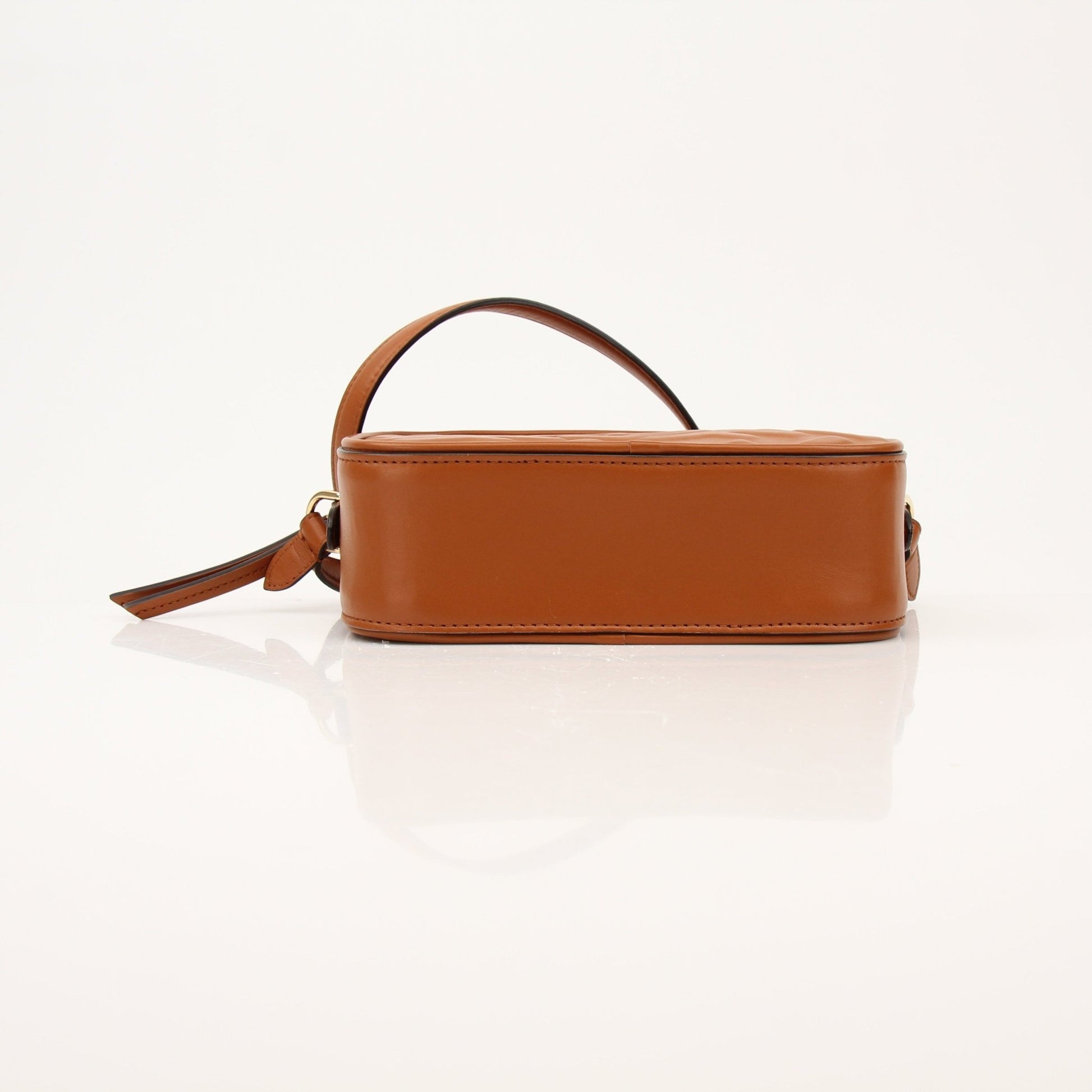 Brown Fendi camera bag wallet with gold accents, featuring a compact design and stylish branding.