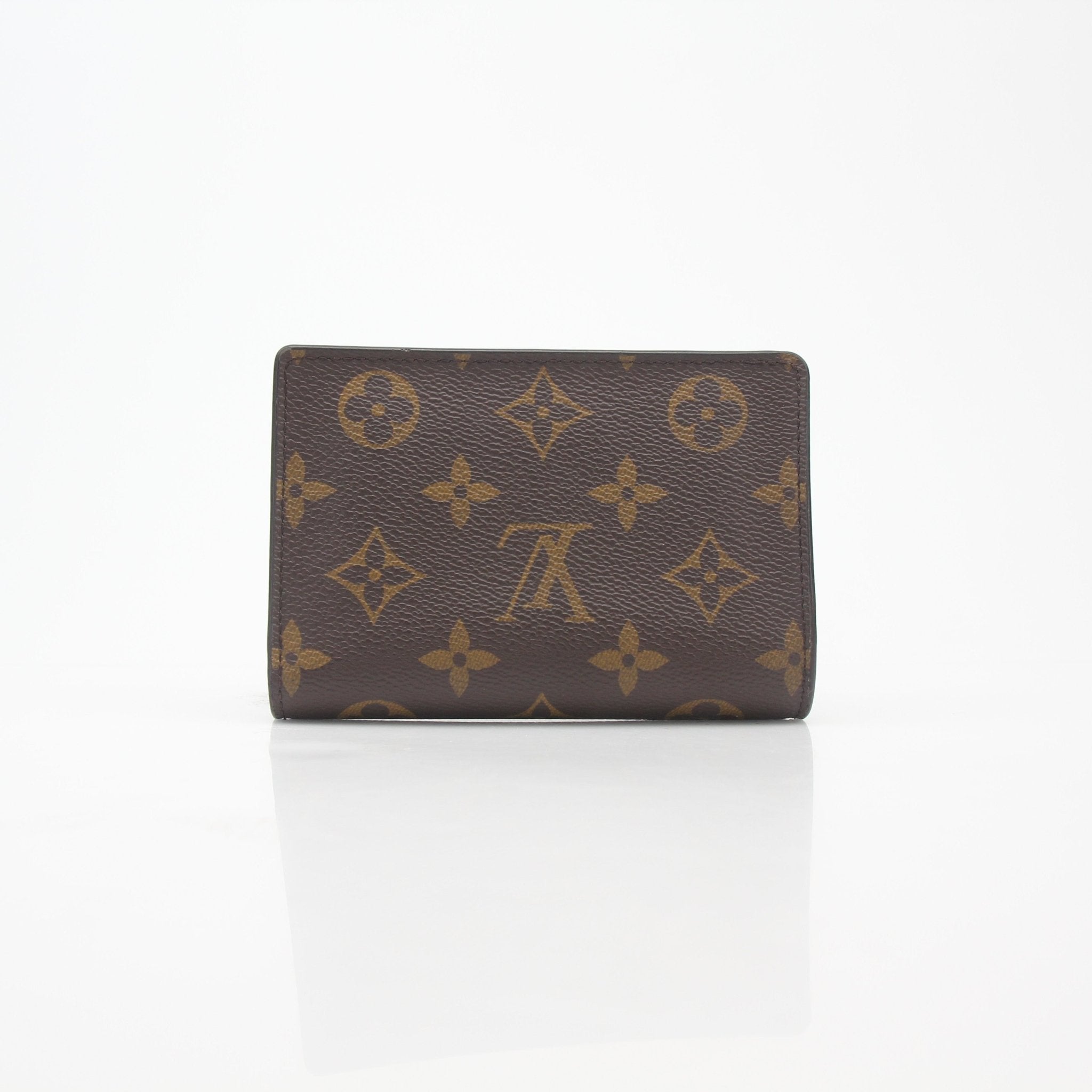 Louis Vuitton Monogram Reverse Juliette Wallet with gold-tone hardware and signature monogram pattern on textured leather.